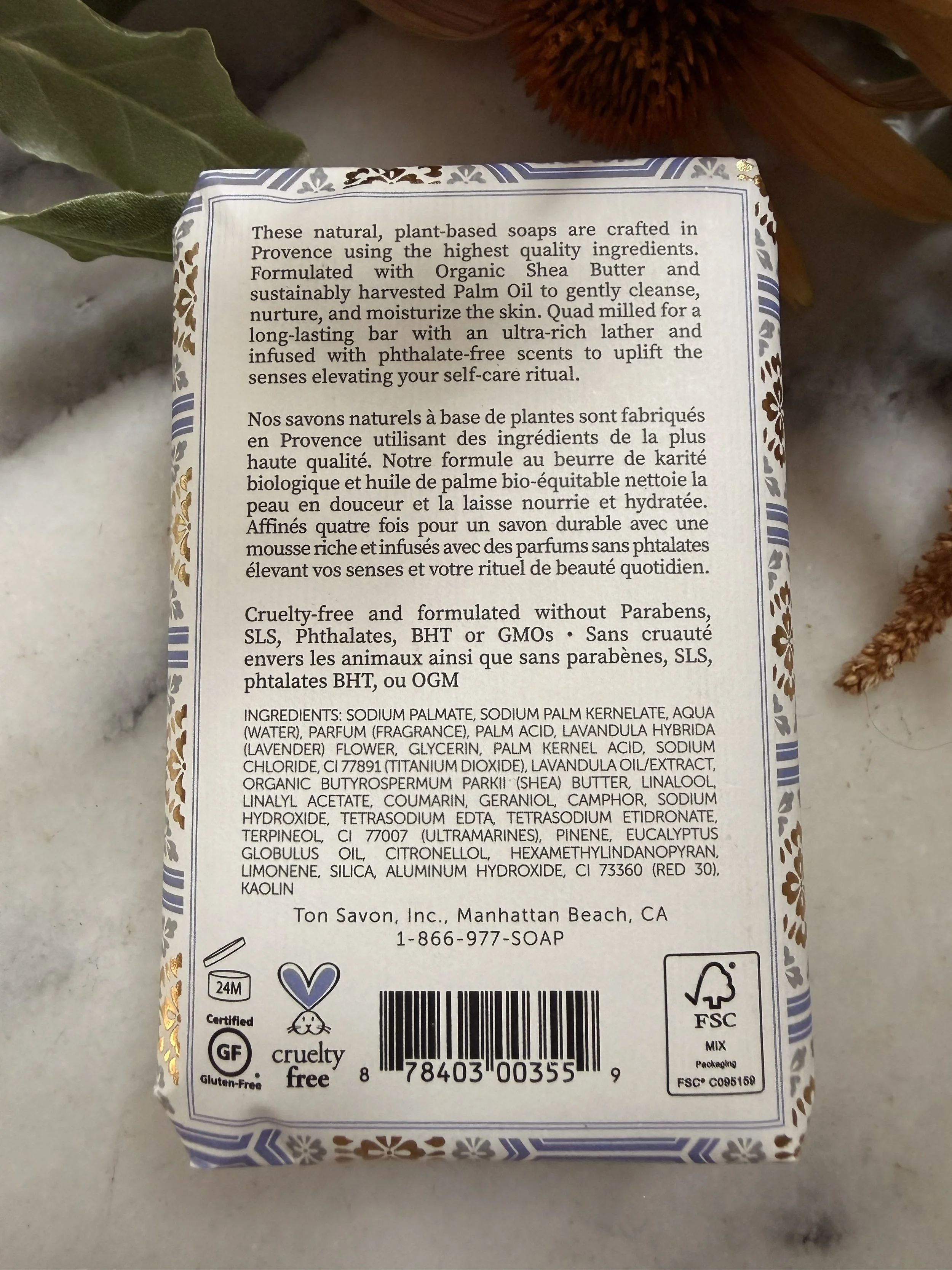 Close-up of back of Terre á Terre Lavender Soap on marble
