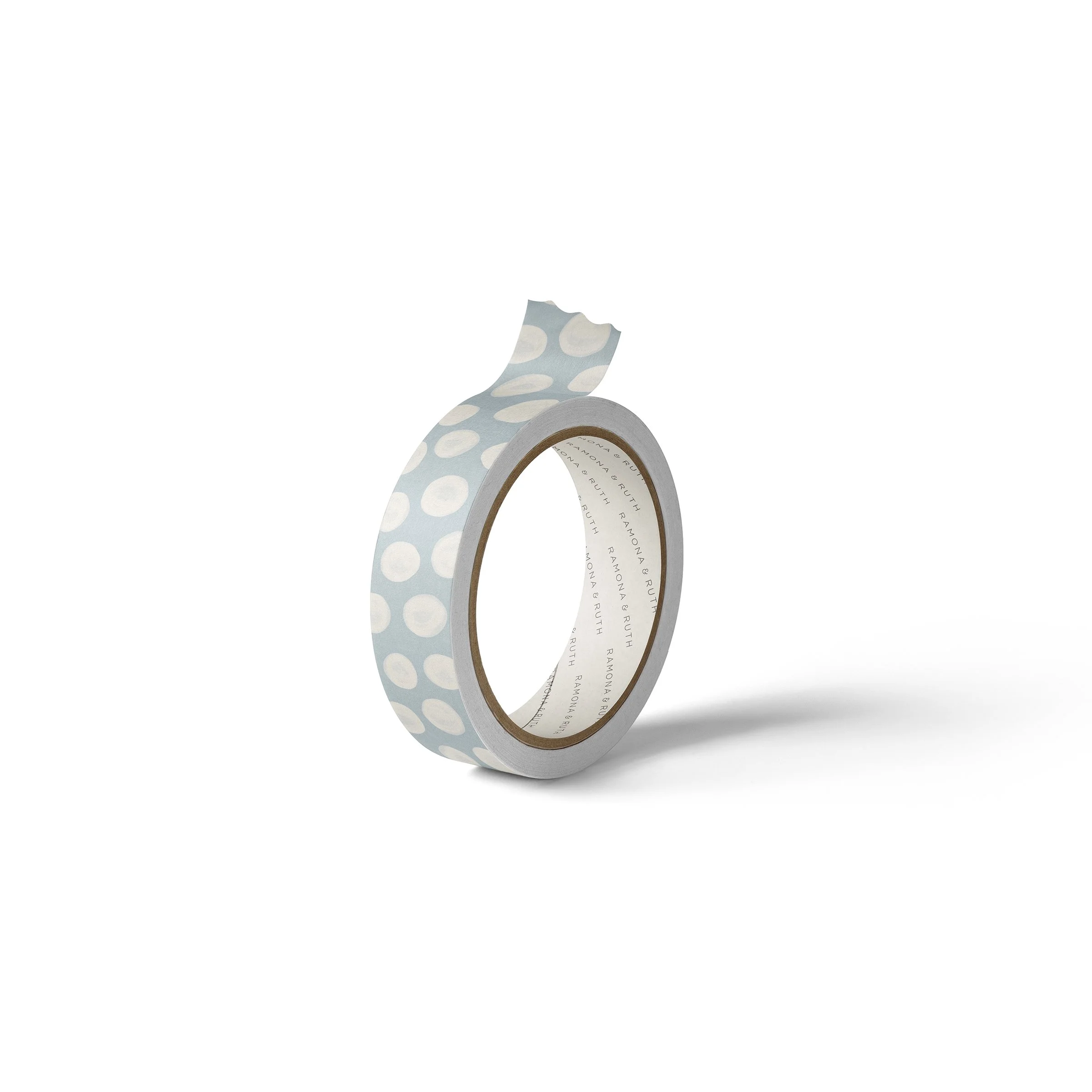 One roll of Ramona & Ruth's Soft Dots Washi Tape on edge with white background