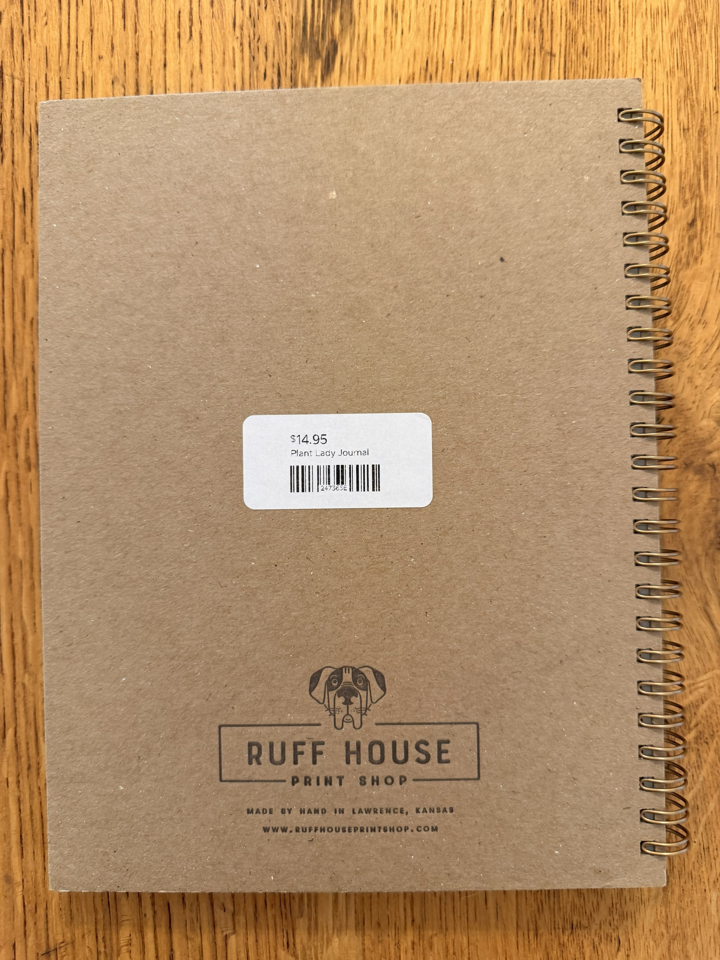 Back of Plant Lady Spiral Notebook on wood countertop