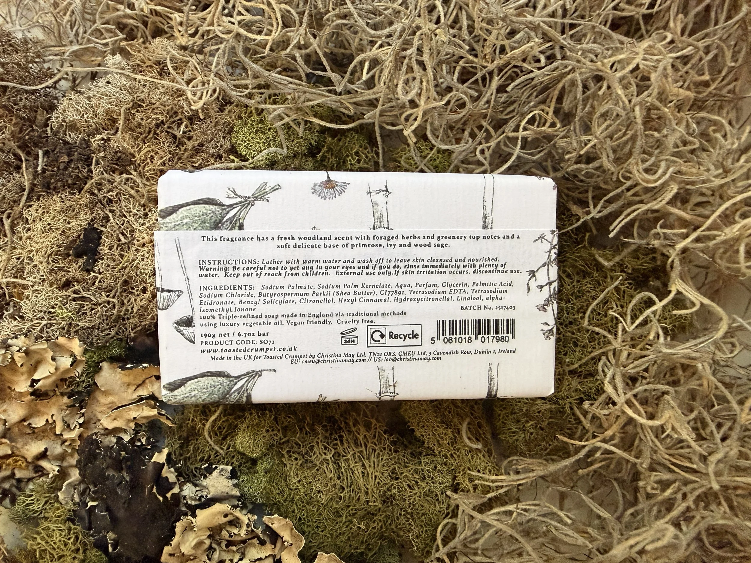 Back of Toasted Crumpet Wild Mushroom and Foraged Herbs Soap styled on moss