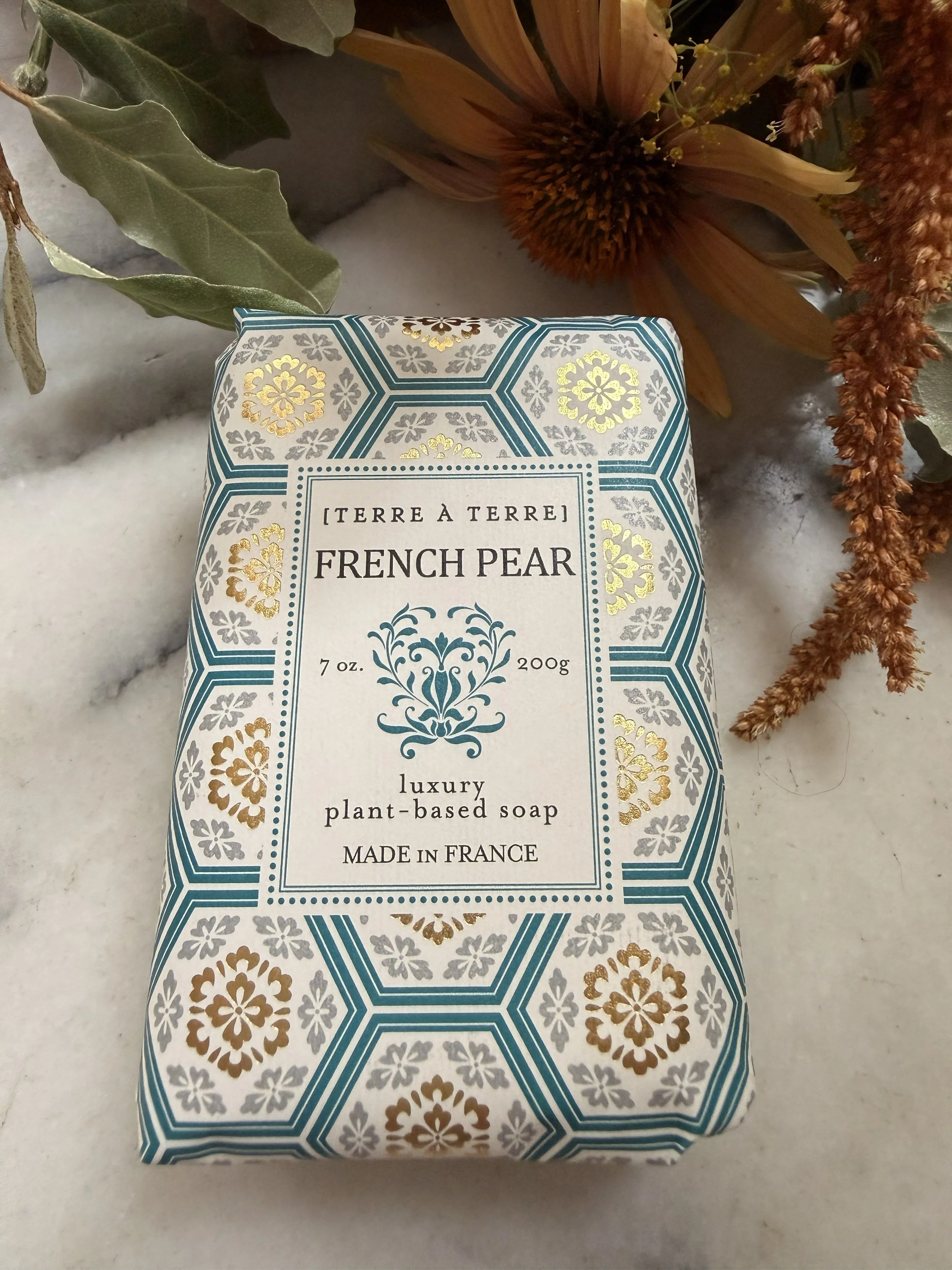 Front of Terre á Terre French Pear Soap with flowers on marble