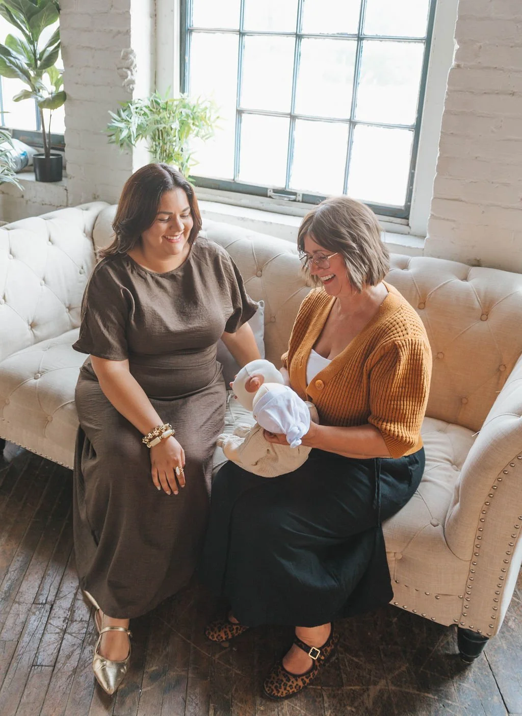Instructor Using Lactation Tools to simulate the latching and lactation process with an expectant mother.