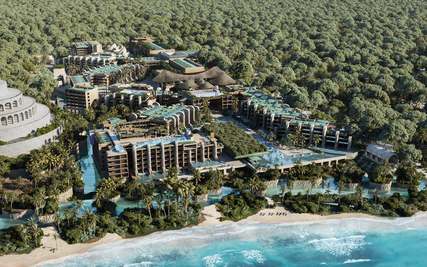 A large luxury resort with multiple buildings, pools, and palm trees situated near a beach with ocean waves, surrounded by a dense forest.