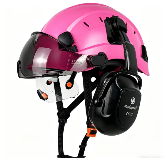 Pink coloured safety helmets with earmuffs and visors in a row