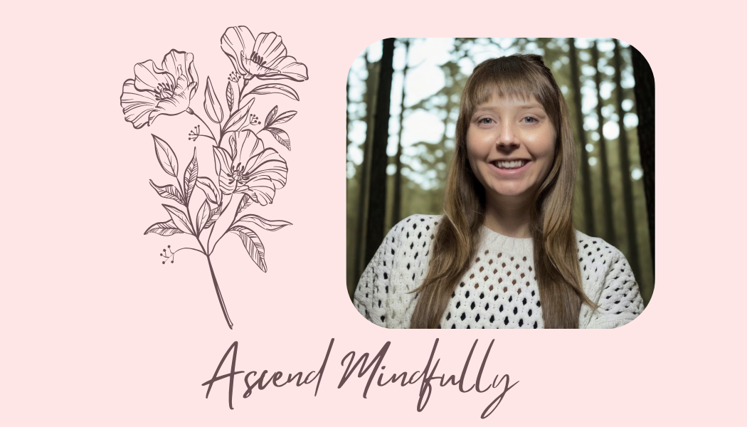 A portrait of a smiling woman with long, light brown hair, wearing a white perforated sweater, set against a blurred forest background. Beside her, a line drawing of blooming flowers on a pink background, with the text 'Ascend Mindfully' written in cursive.