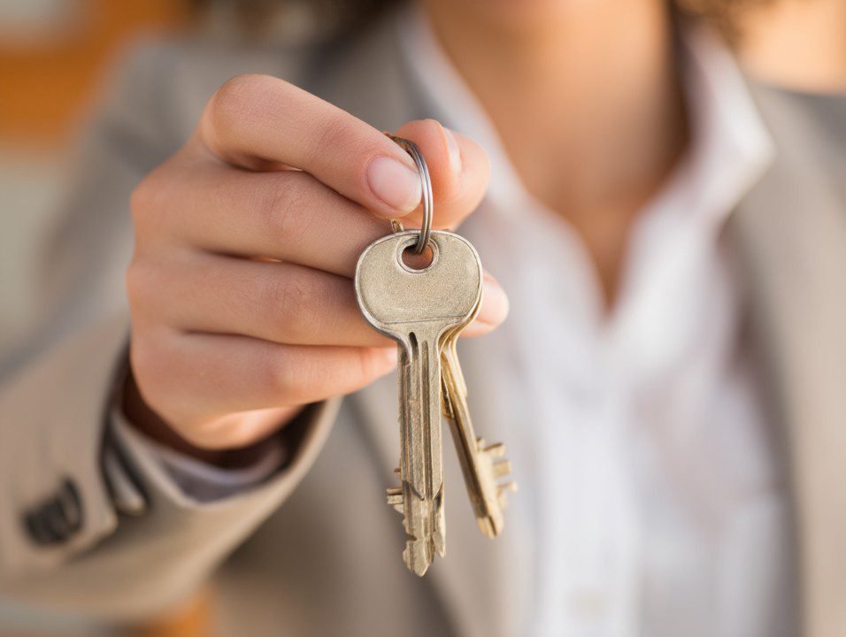real-estate-agent-giving-keys.jpg