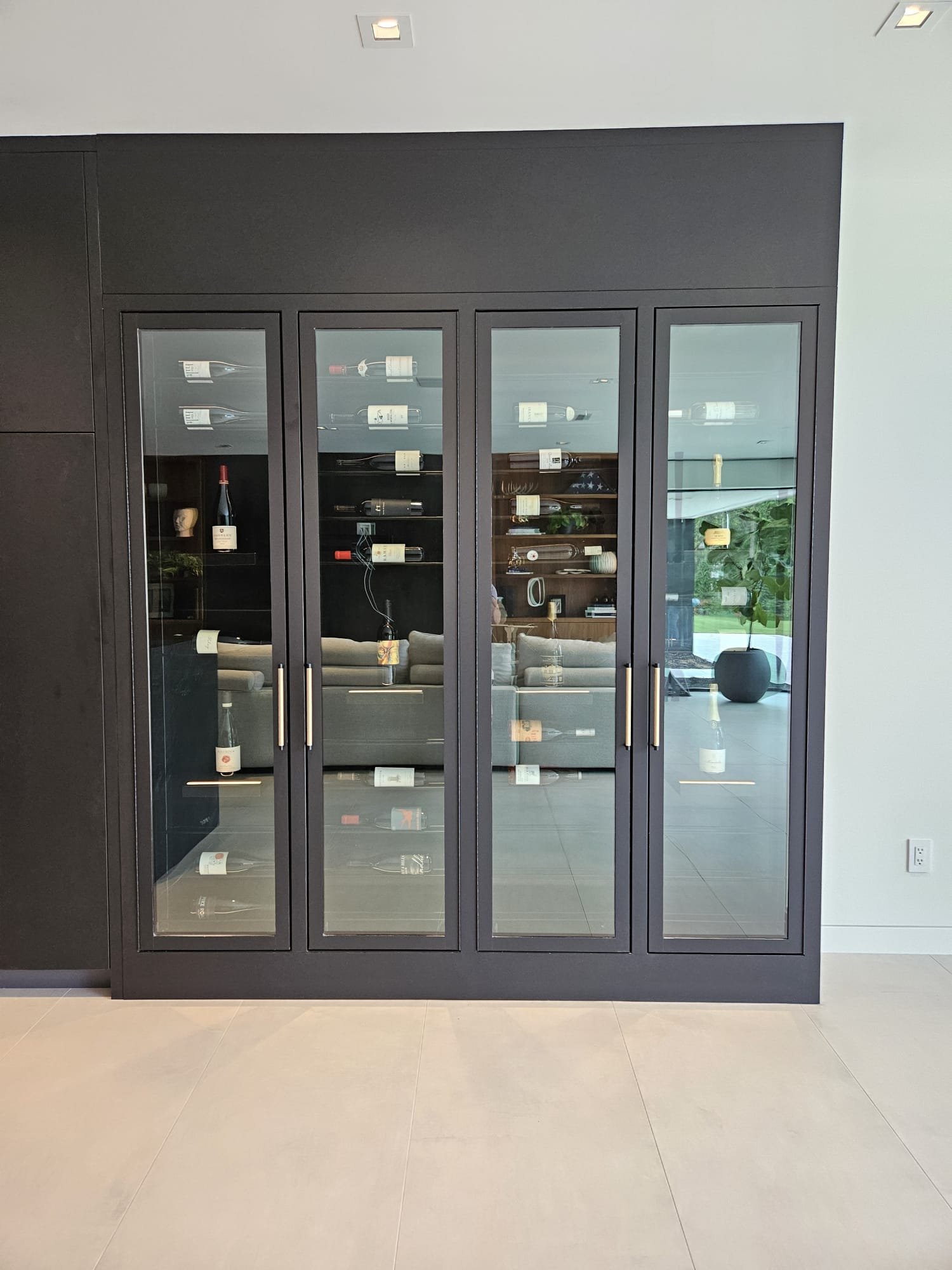 Custom low profile wine cabinet accentuating lake views.