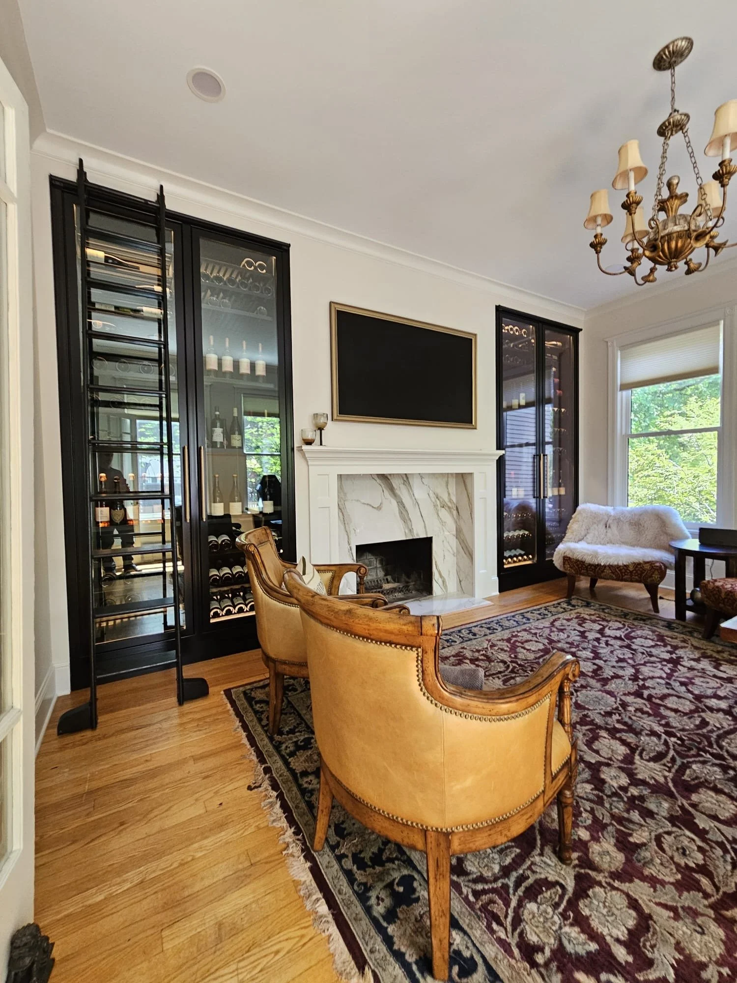 Reach in cabinets framing fireplace achieving temperature control while maximizing bottle count