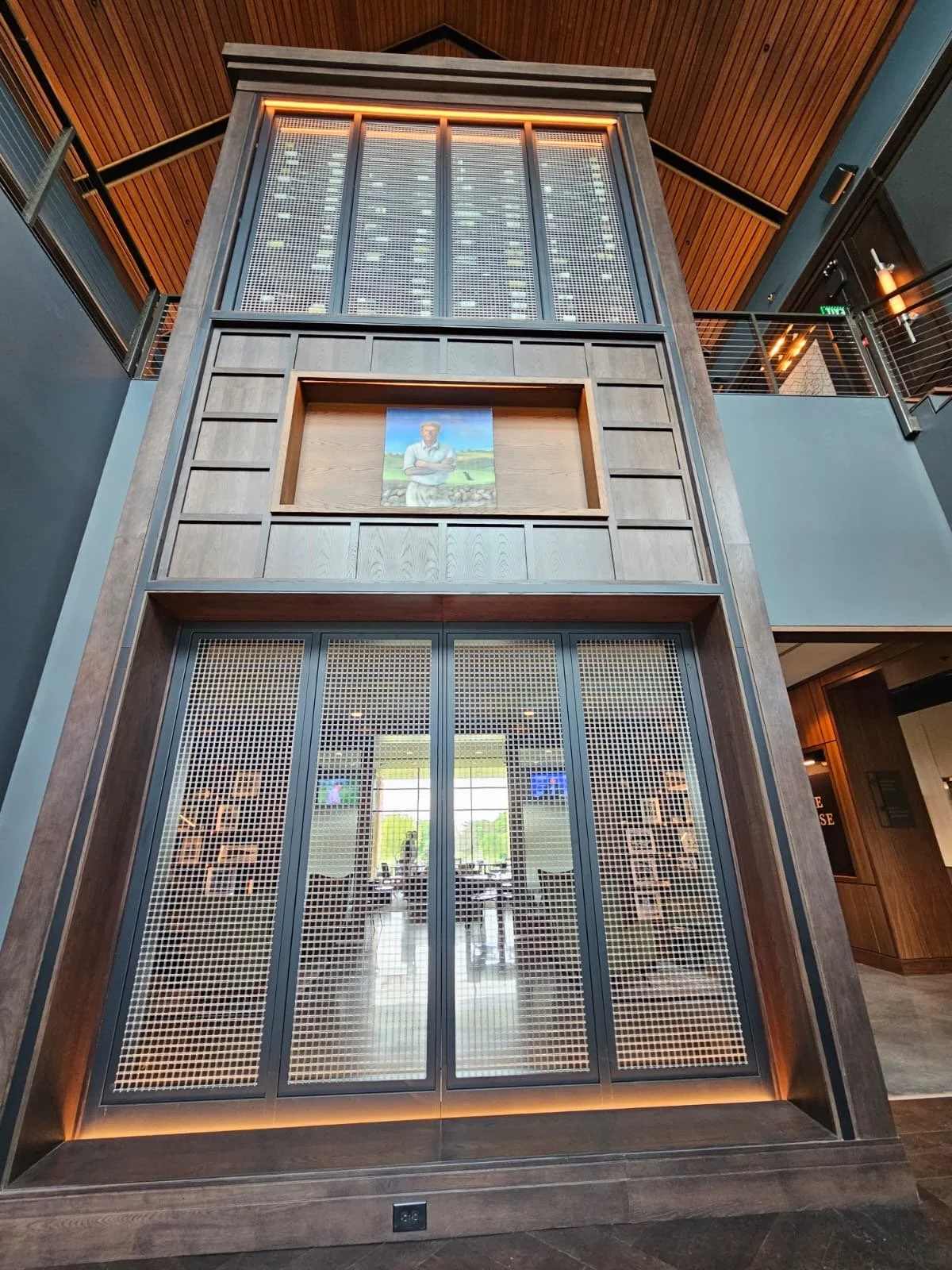 An exclusive golf course for Purdue alumni this two story wine cellar with visual lines throughout the clubhouse.