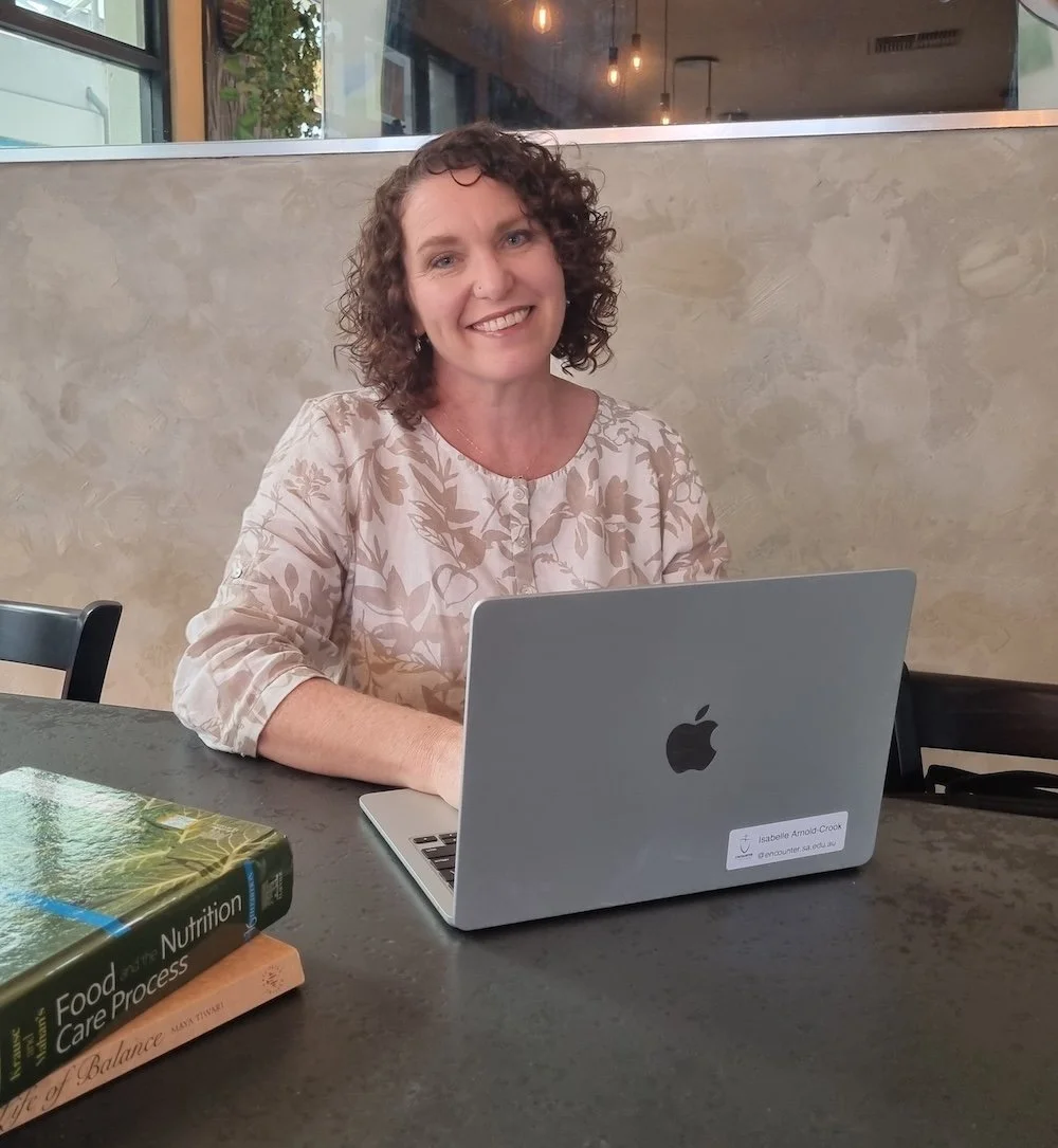 Renae Arnold Clinical Nutritionist working on personalised nutrition plans in a calm clinic setting