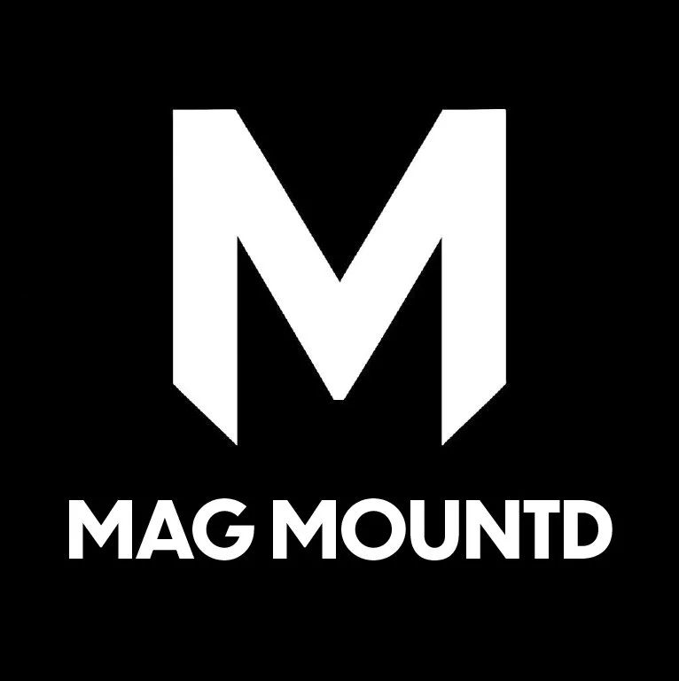 Black background with a large white letter "M" and the text "MAG MOUNTD" underneath.