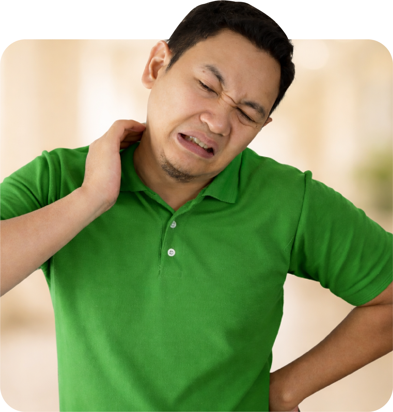 Man in a green polo shirt appears to be experiencing neck pain, holding his neck with a pained expression.