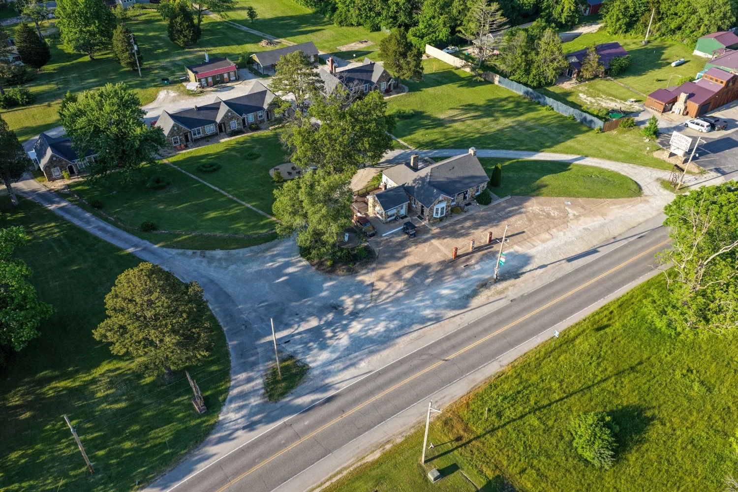 Aerial view of the Wagon Wheel Motel’s Ozark sandstone buildings, motor court and Route 66 frontage in Cuba, Missouri.
