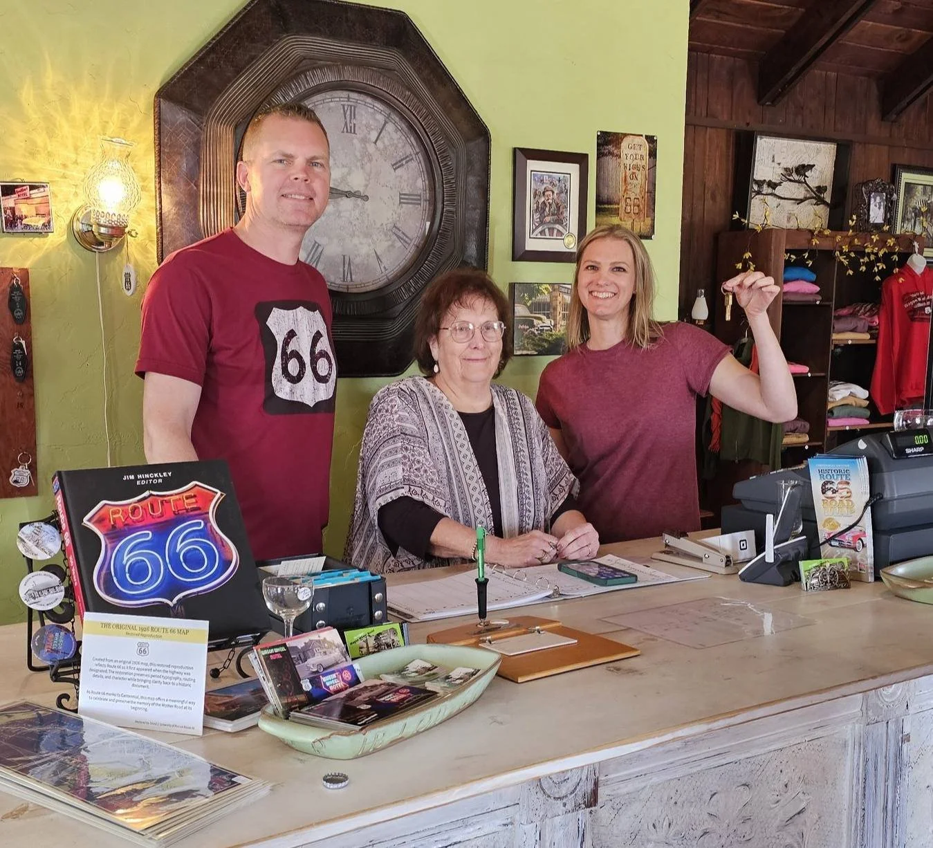 Rich and Christina Dinkela with Connie Echols inside the Wagon Wheel Motel office