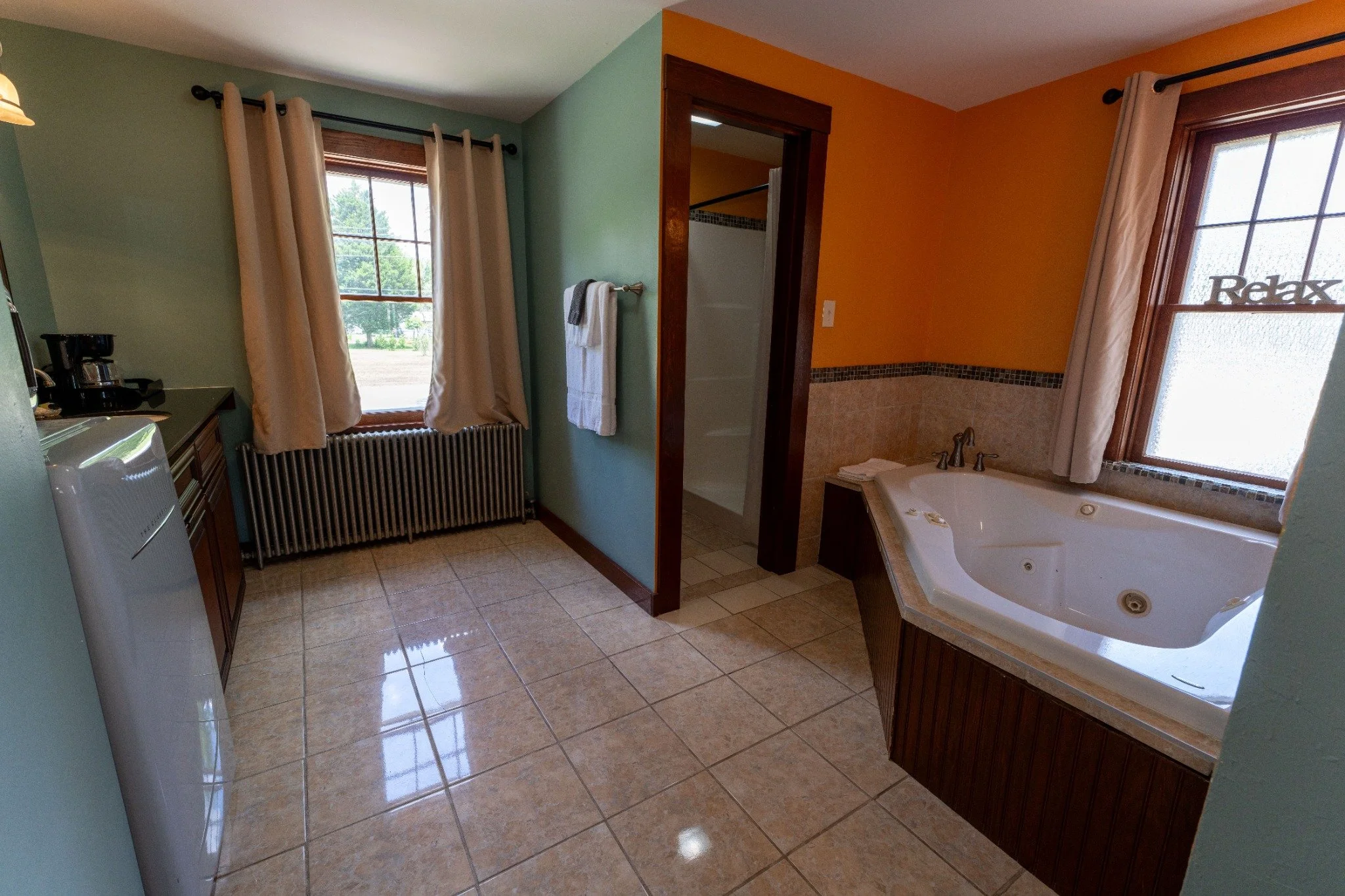 Jacuzzi-room bathroom with a tub and original architectural character