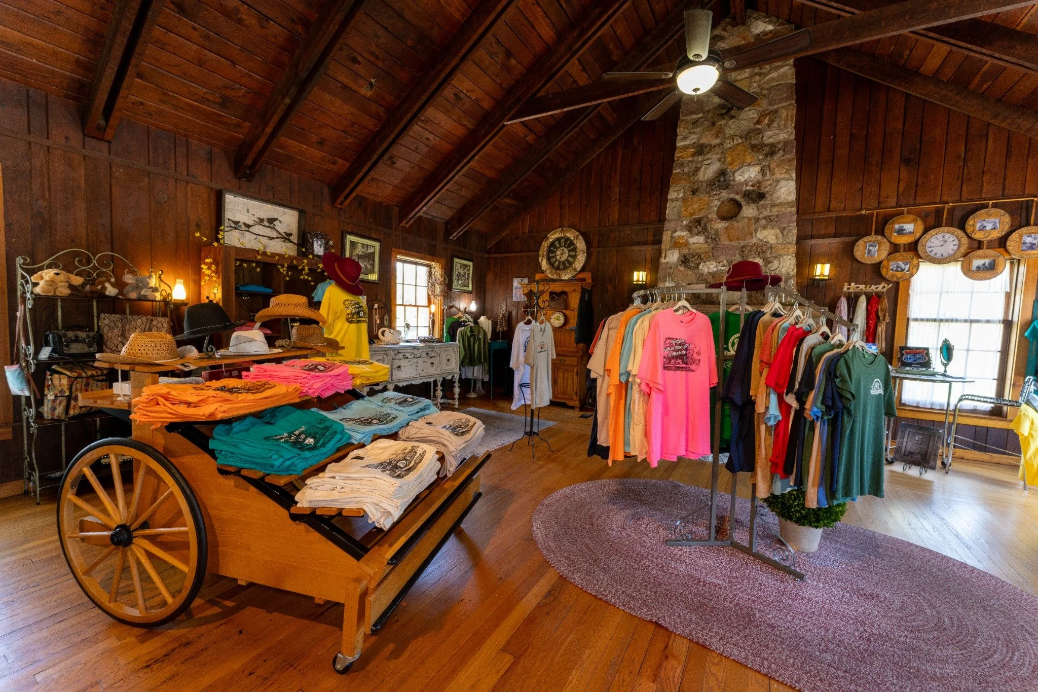 Interior of the Wagon Wheel Motel shop with Route 66 gifts, clothing, woodwork, and historic details.