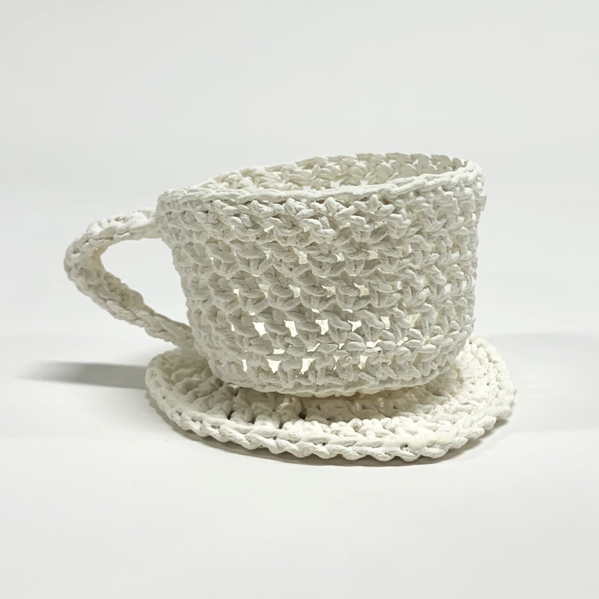 Cup and Saucer, Porcelain, Cup: 2”H x 3.75”W x 2.5”D, Saucer: .25” x 4” x 4”, 2024