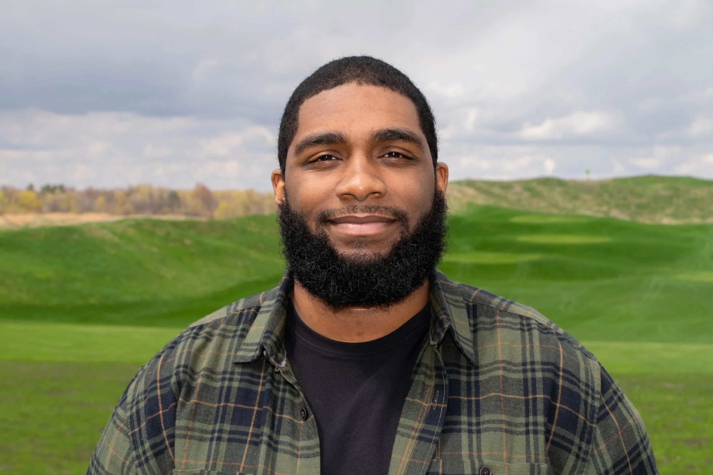 Image of me standing in front a plush field