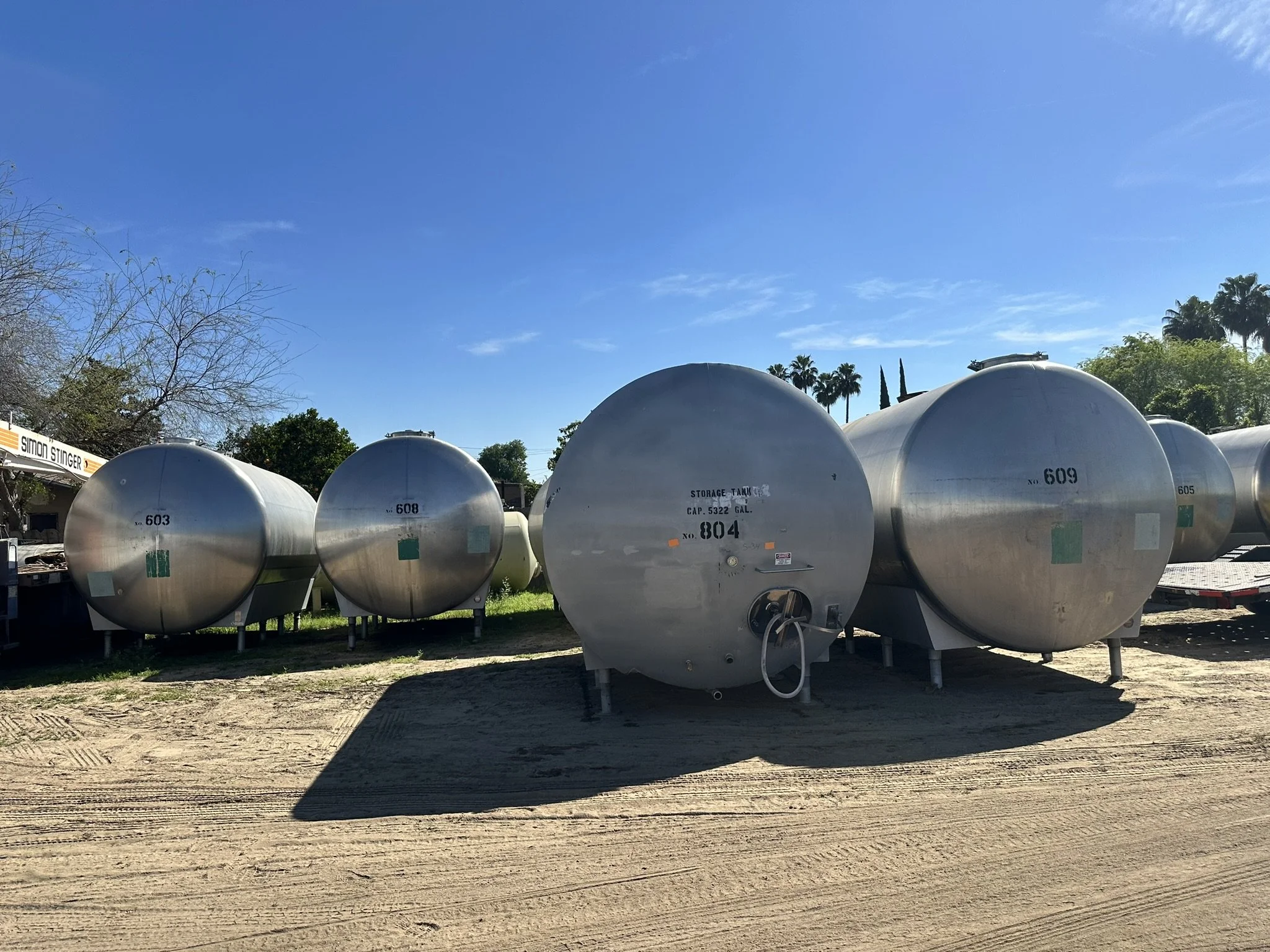 A5: (multiple) 5,000 Gallon Horizontal Stainless Steel Tank. 
Dish top, dish bottom, single walled, steel legs