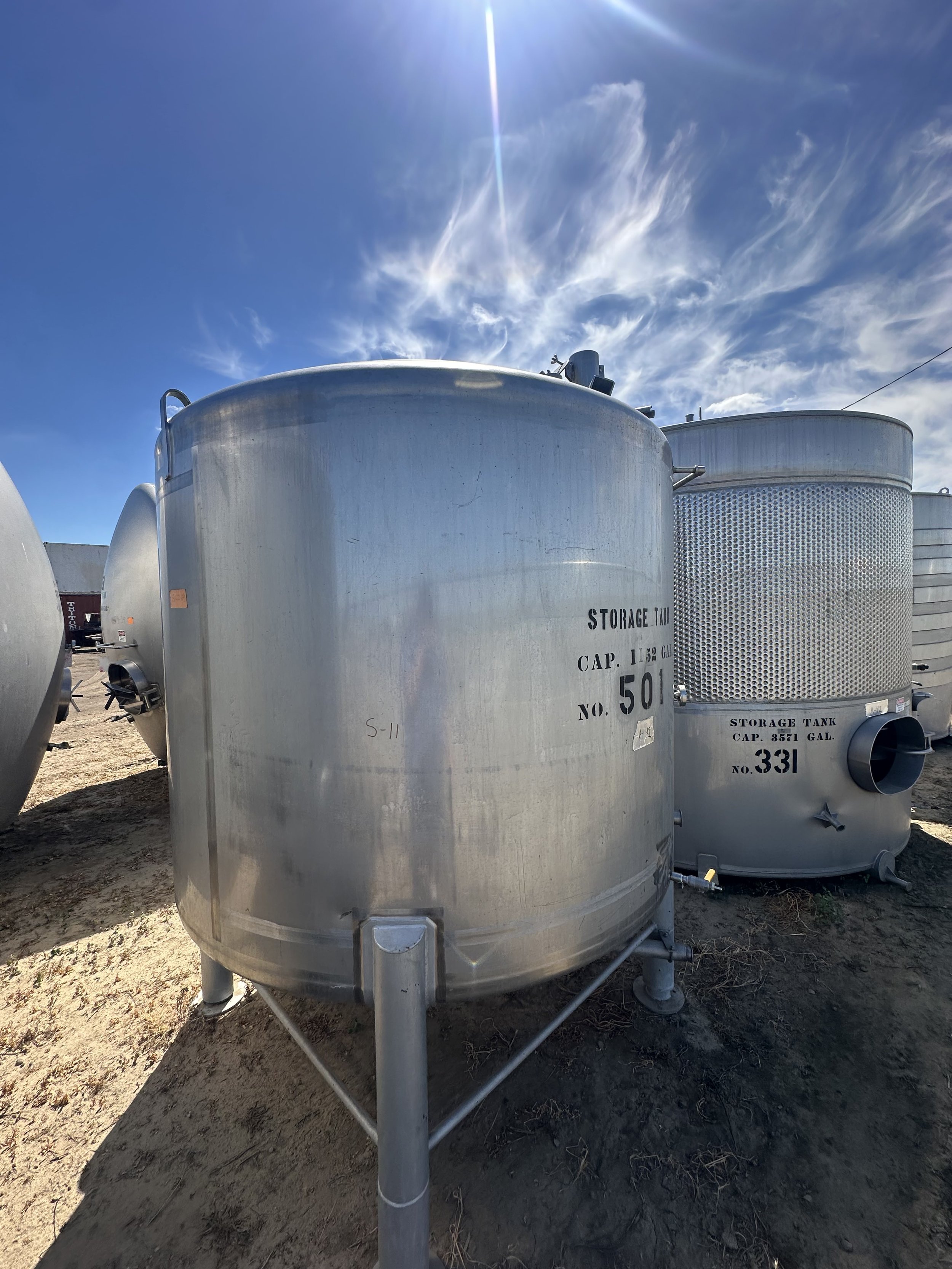 A40 2026: 1,100 gallon dish bottom stainless steel food grade tank.