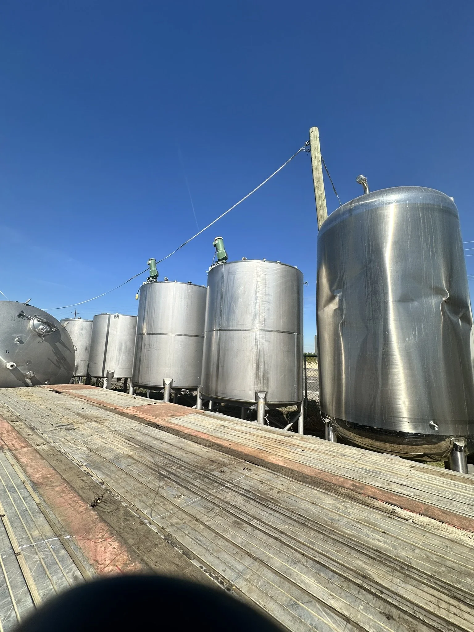 A18: Multiple 700 Gallon Vertical Stainless Steel Tanks 