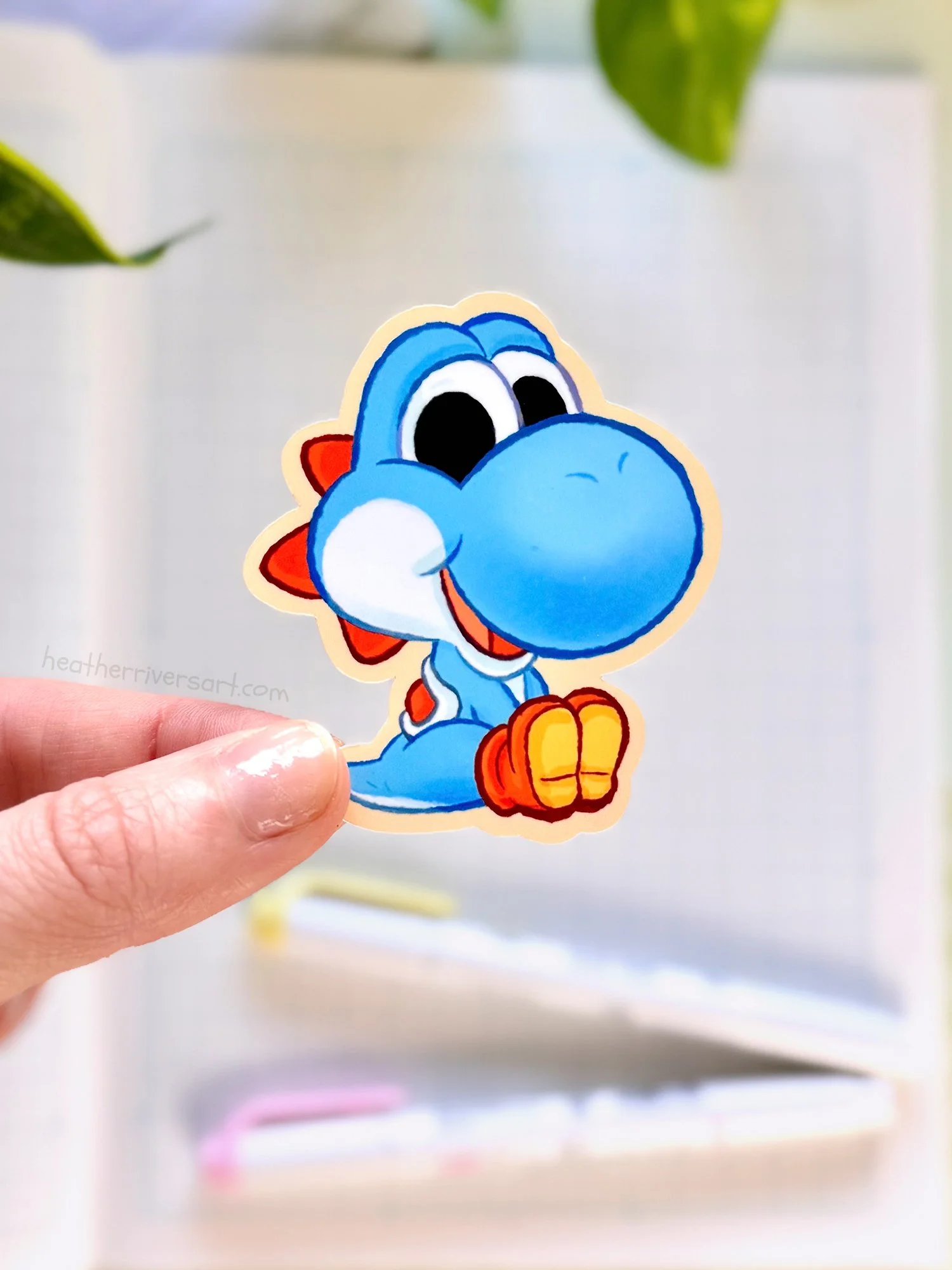 Yoshi_BlueSit_Sticker_Hand.jpg