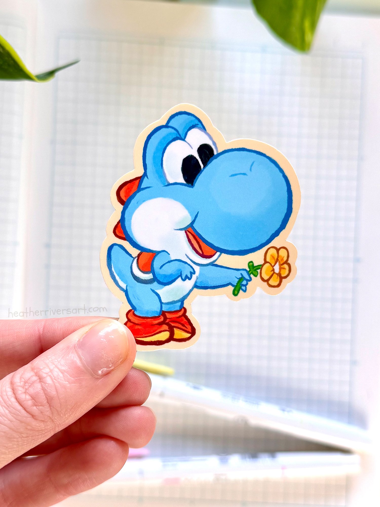 Yoshi_BlueFlower_Sticker_Hand.jpg