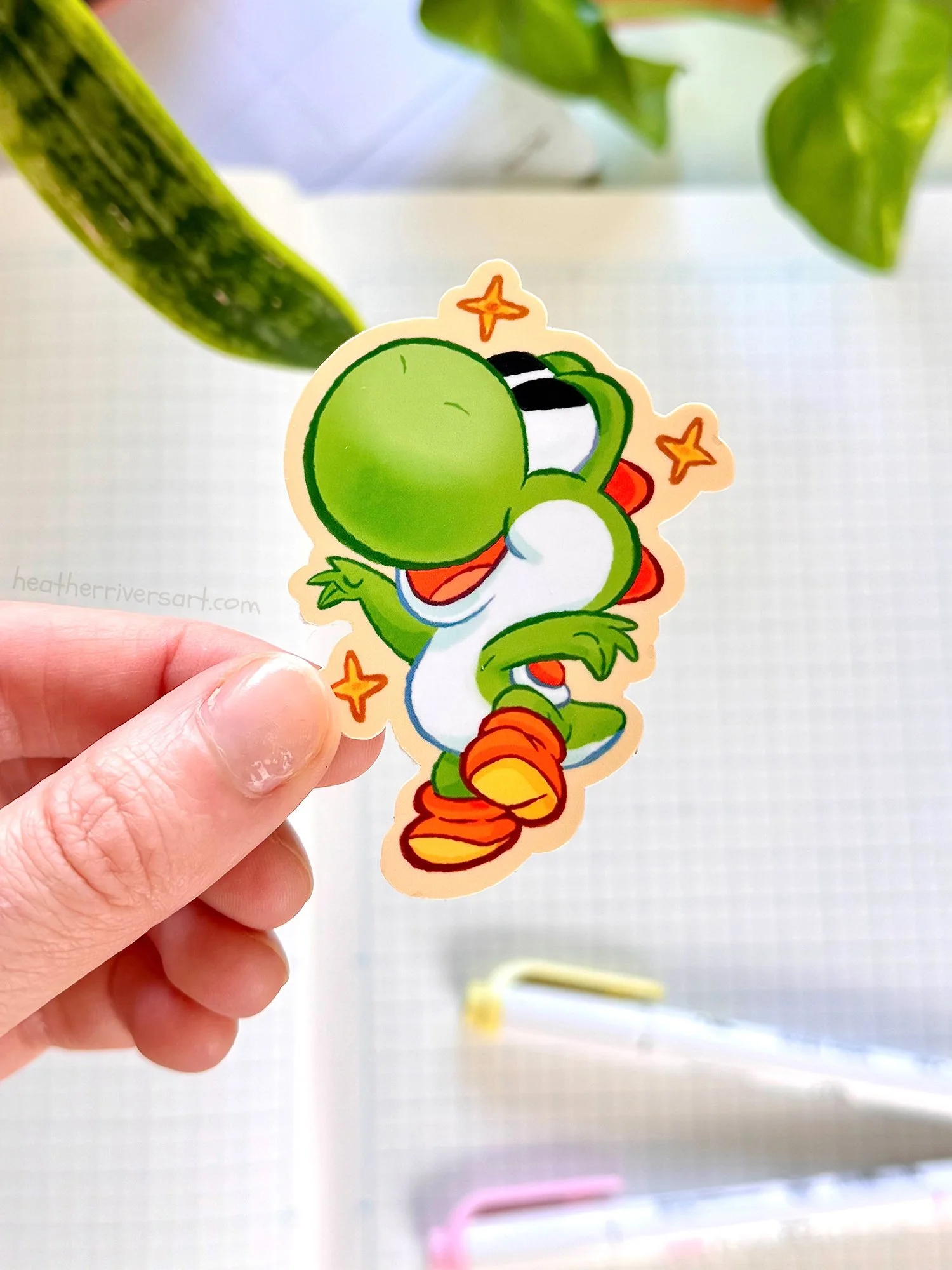 Yoshi_GreenSparkle_Sticker_Hand.jpg