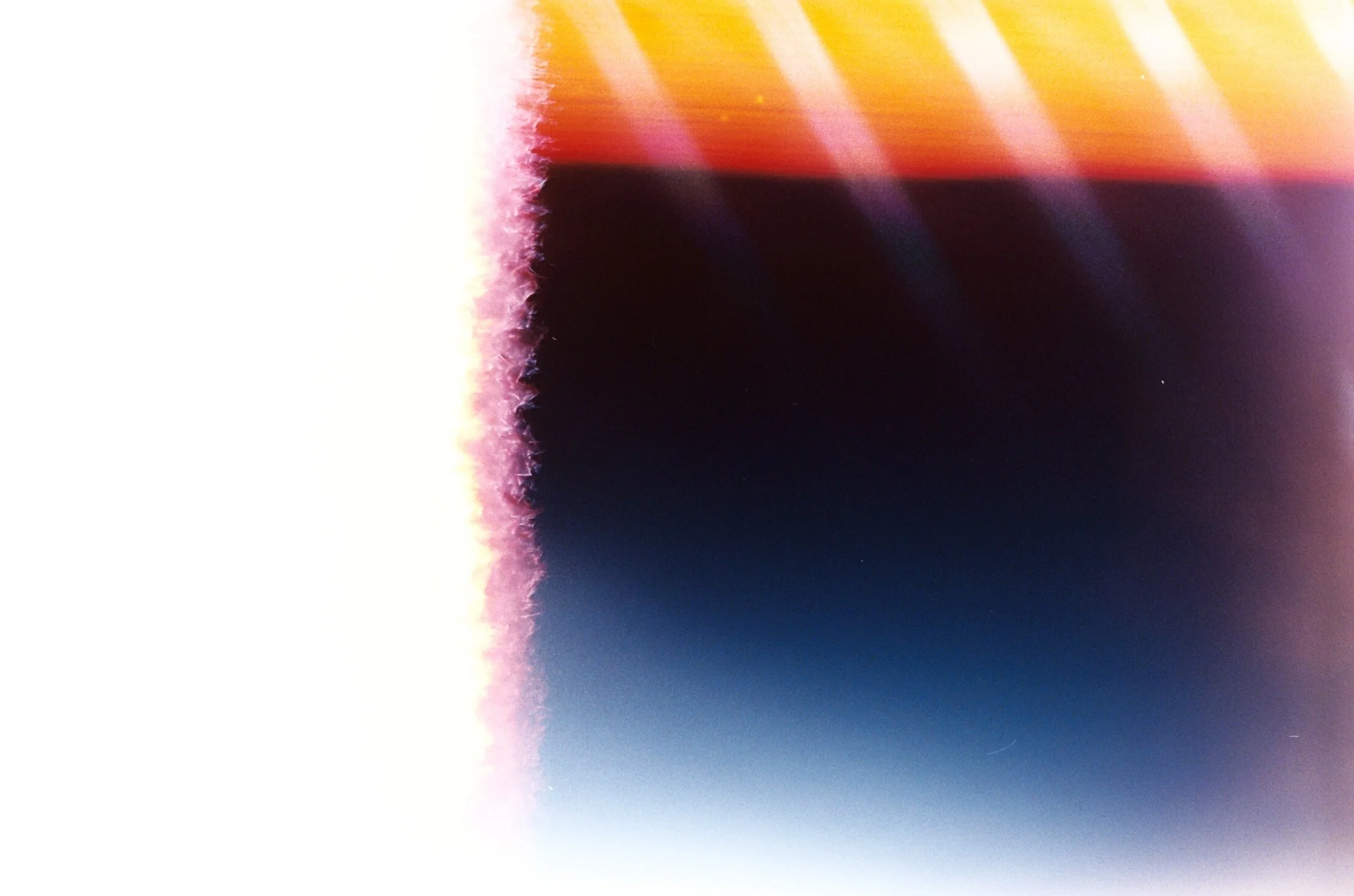 Abstract digital art with streaks of pink, orange, purple, yellow, and black colors.