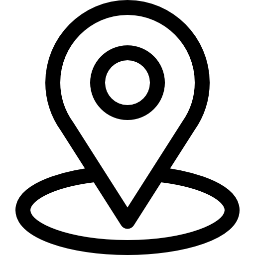 A black silhouette of a person surfing on a wave.