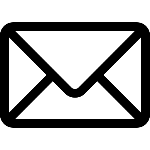 Silhouette of a person holding a flashlight in a dark cave, illuminating the rocks.