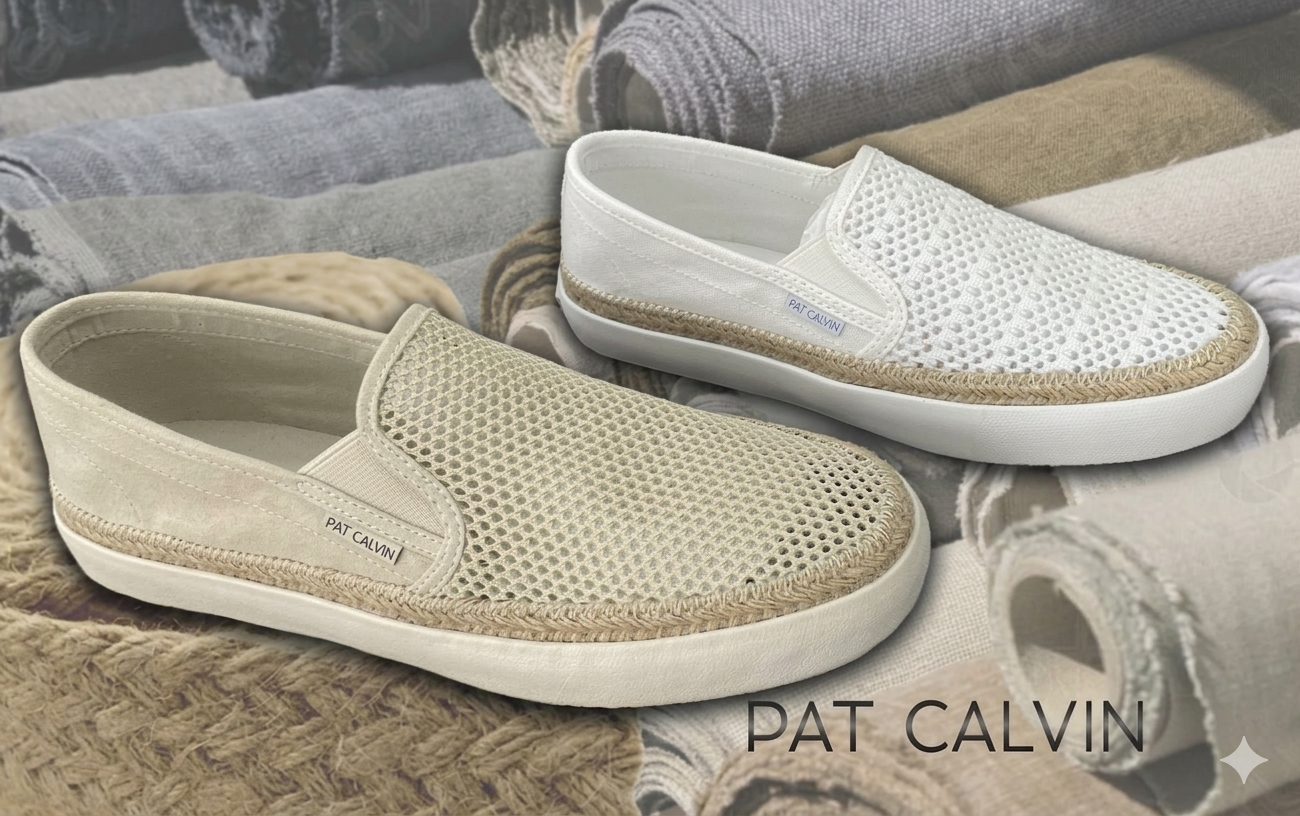 Pair of slip-on shoes, one off-white and one white, with mesh and jute detail, placed on rolled-up towels and fabric in background.