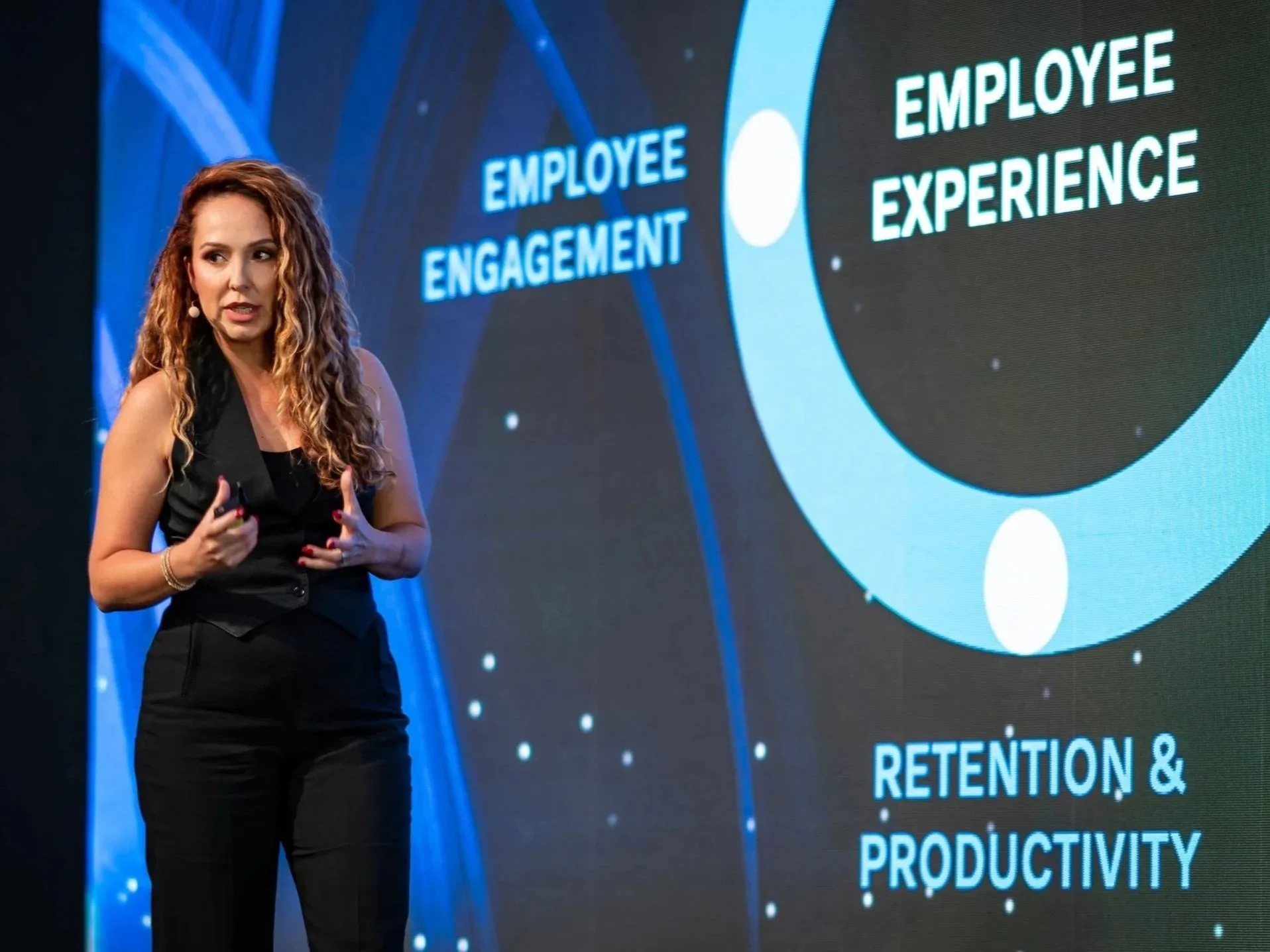 Es Leibig presenting on employee engagement, culture and experience at a leadership conference