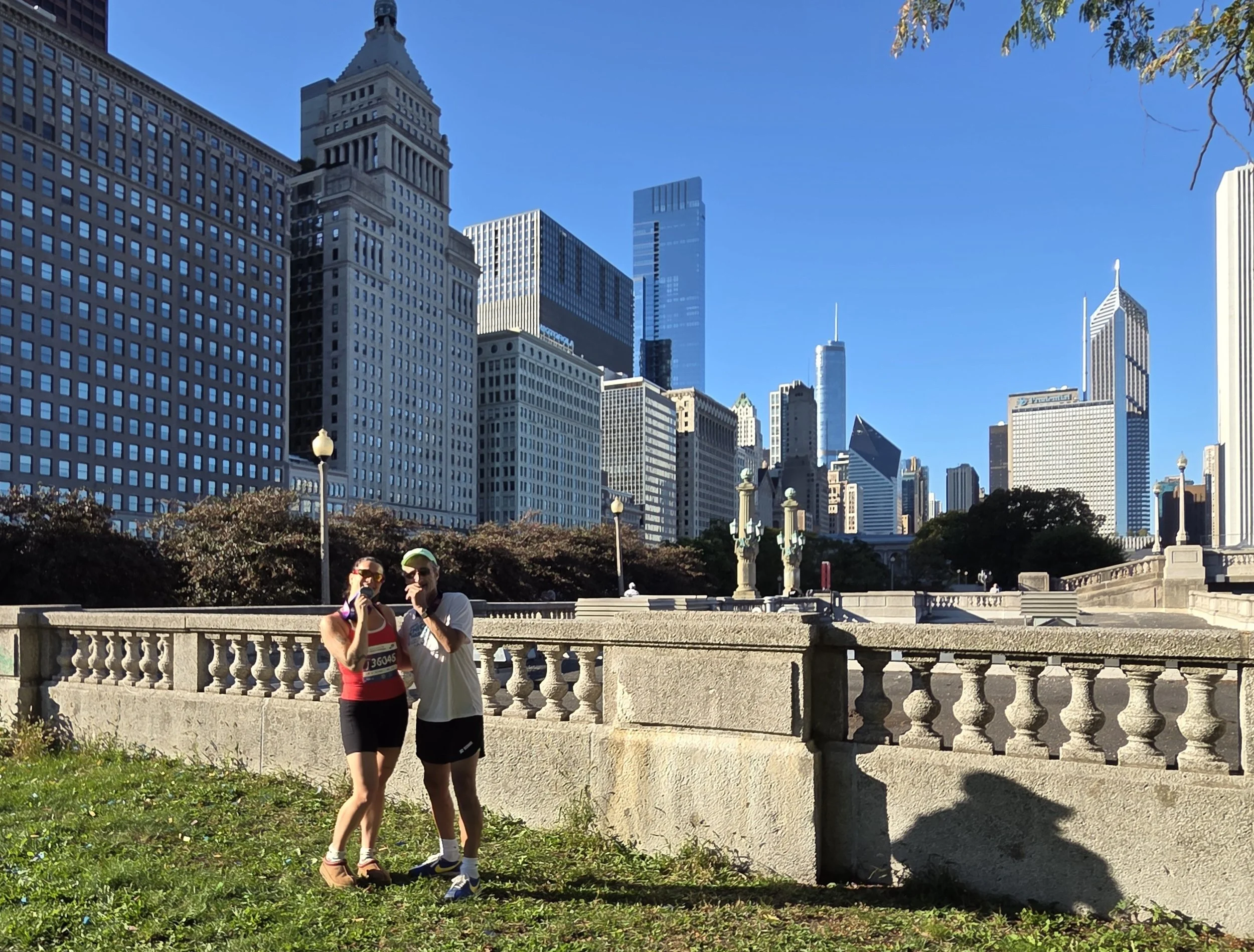 Father and daughter smiling with their medals at the Chicago Marathon