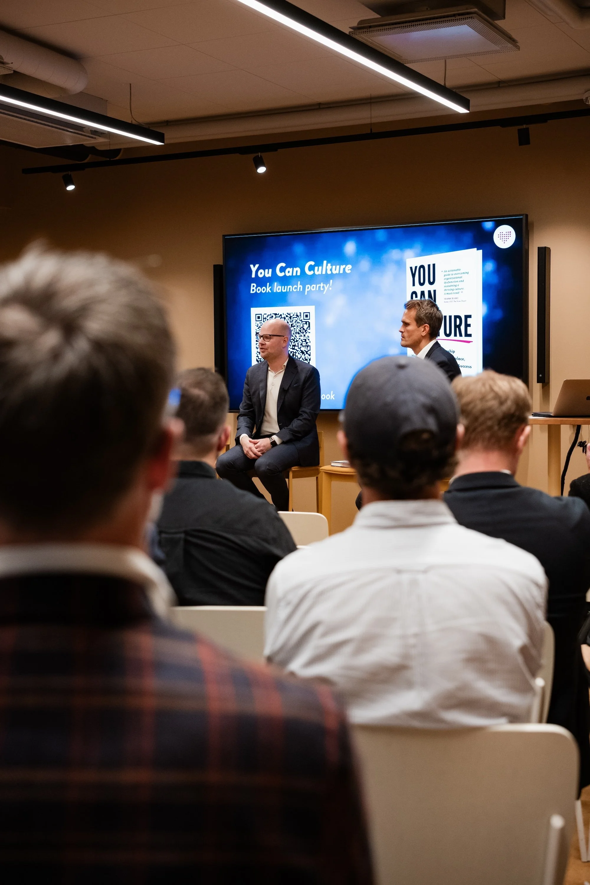 A book launch event for 'You Can Culture' with Tobias Sturesson and Andreas Almlöf in front of an audience.