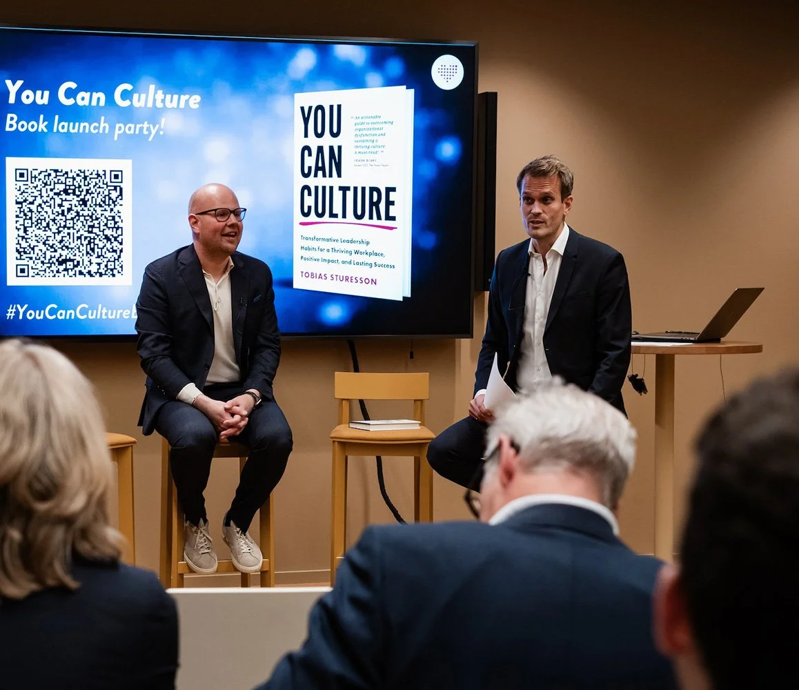 A book launch event for 'You Can Culture' with Tobias Sturesson and Andreas Almlöf in front of an audience.
