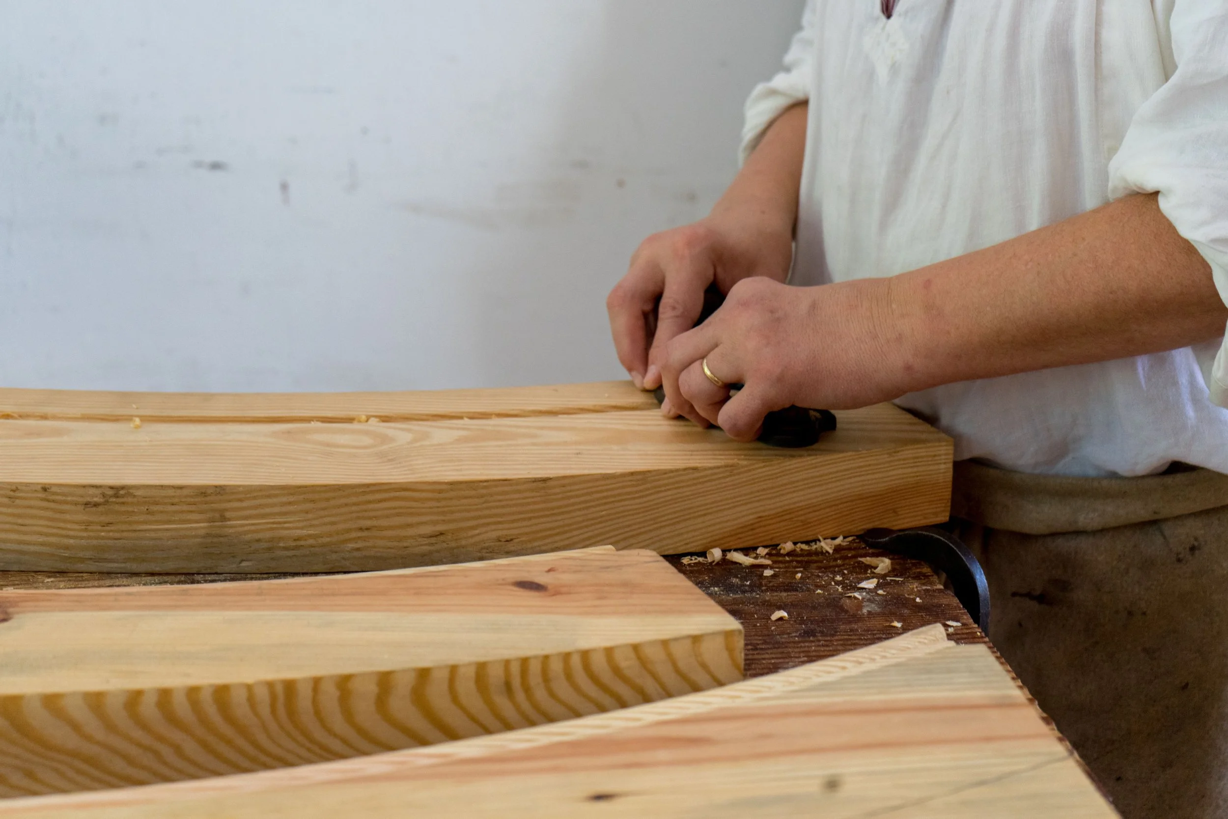 Craftsman working wood in a workshop - Z3 Collective