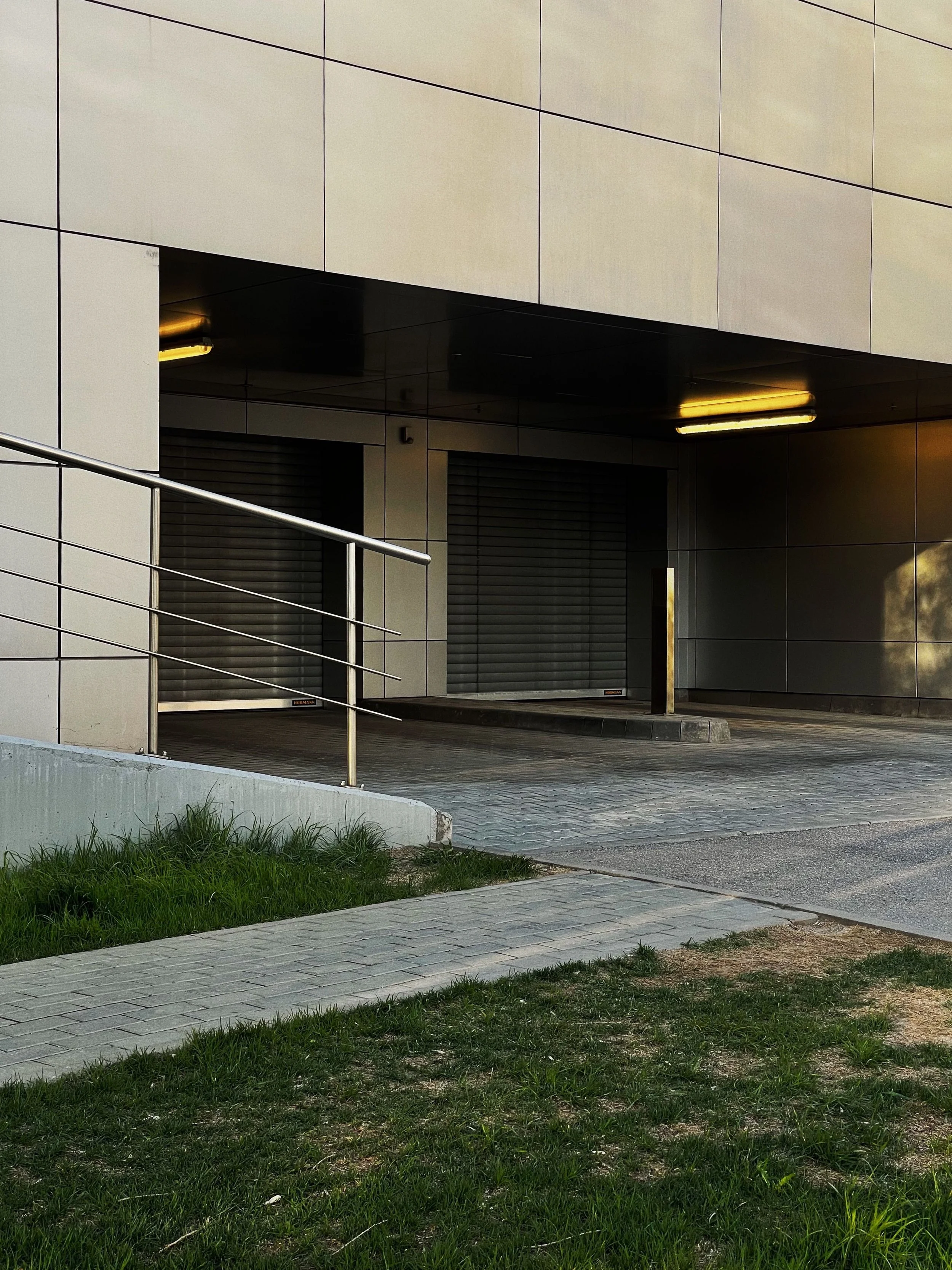 Accessible building entrance with wheelchair ramp - ADA remodeling by Z3 Collective