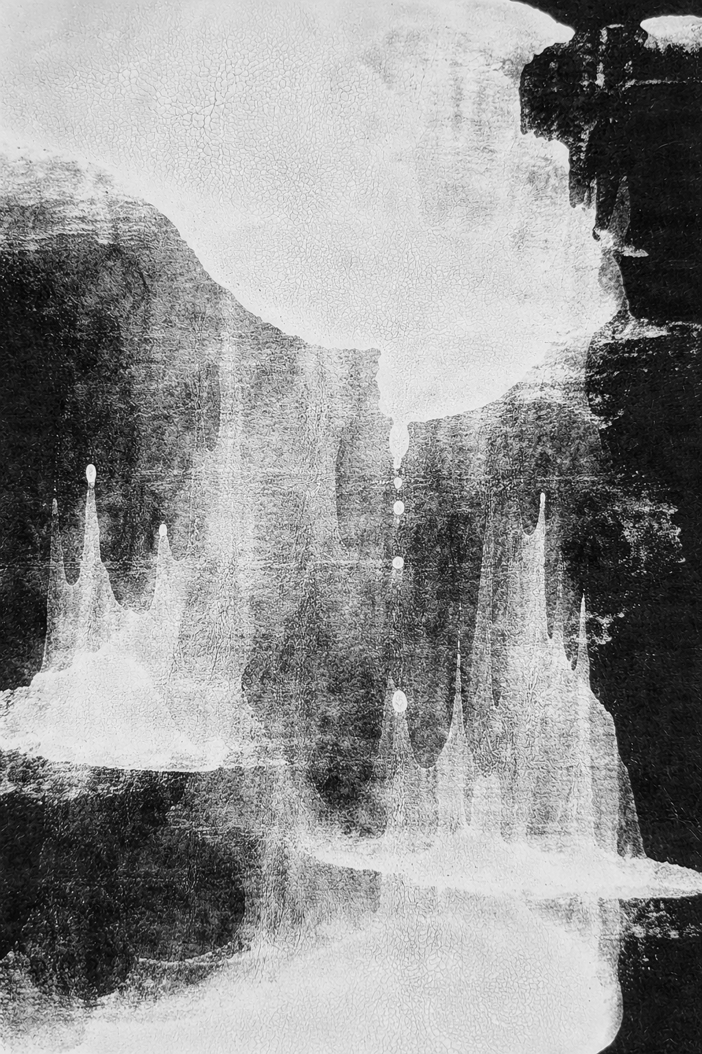 Black and white abstract art featuring a symmetrical composition of dripping paint and textures, resembling a canyon or rock formation.