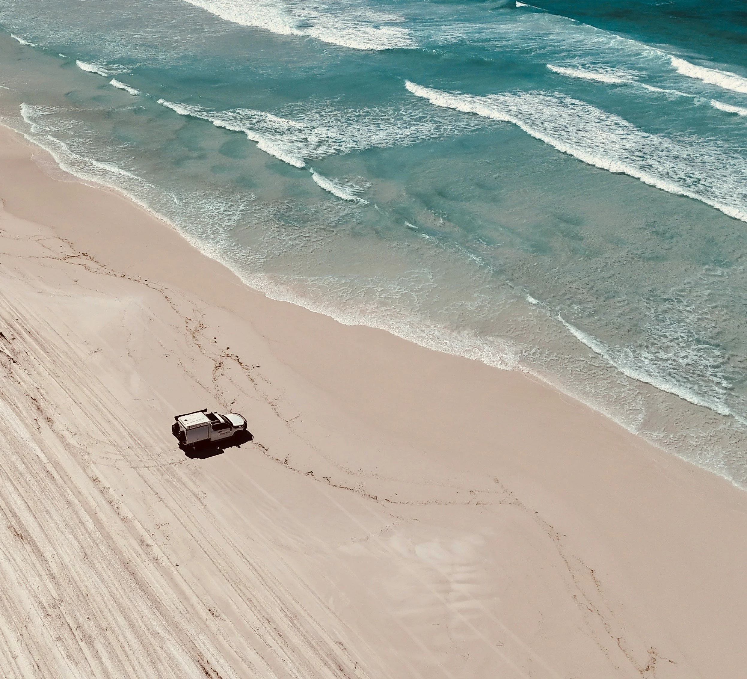 Four wheel drive parked on the beach Perth Western Australia