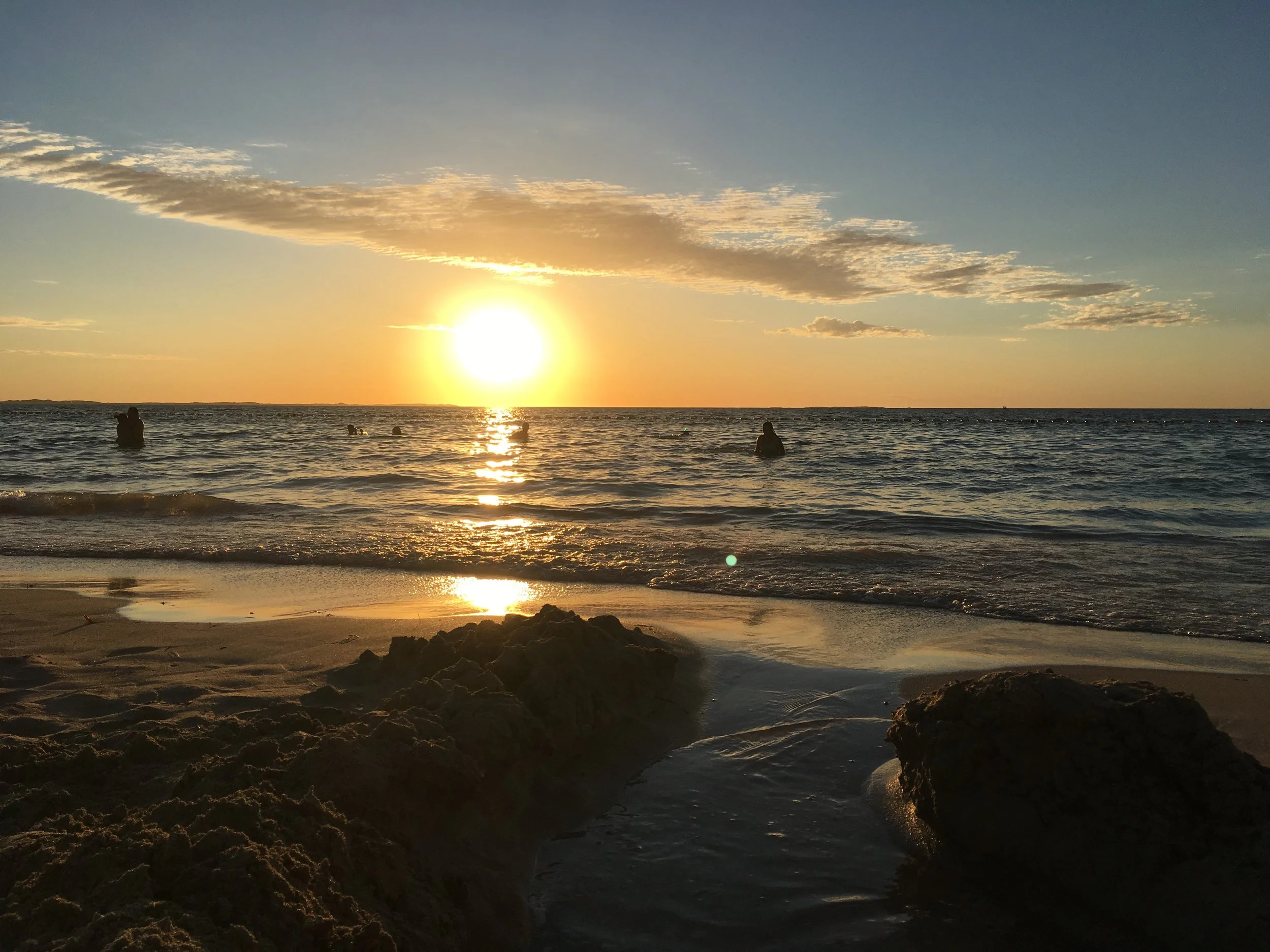 Sunset over South Beach Perth Western Australia people swimming