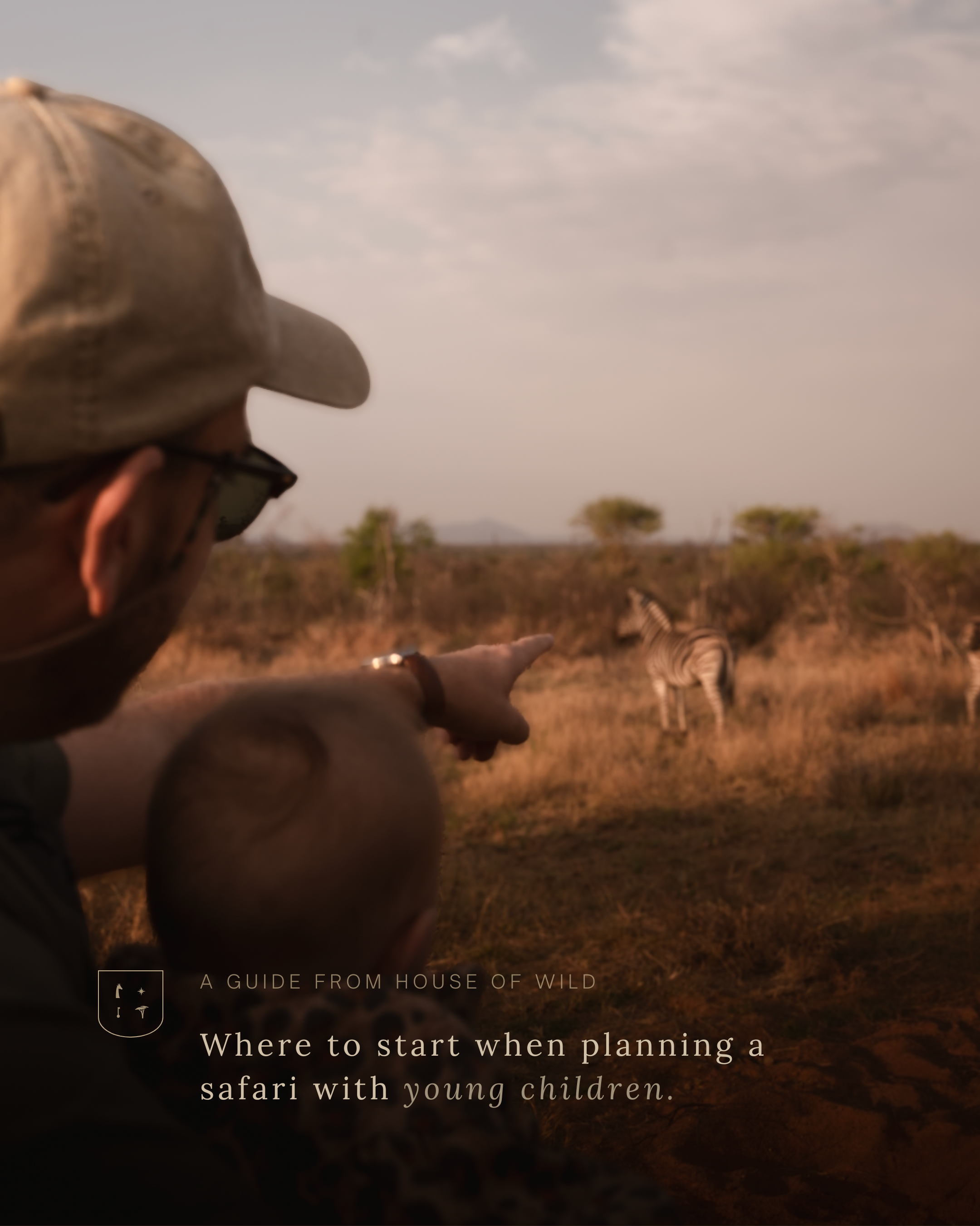 A person wearing a beige cap and glasses pointing at zebras in a savannah landscape during daytime.