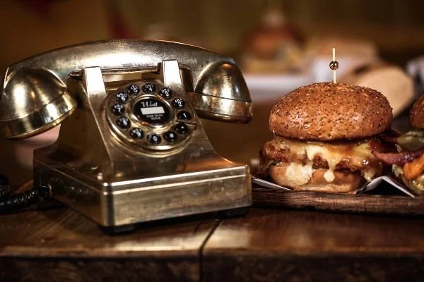 Take-away burger with phone