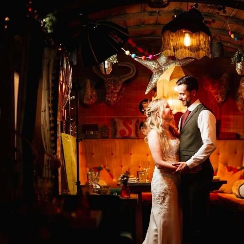 Bride and groom dancing in train carriage.jpg
