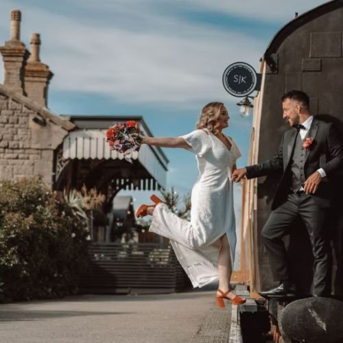 Wedding couple on train in West Bay, Dorset