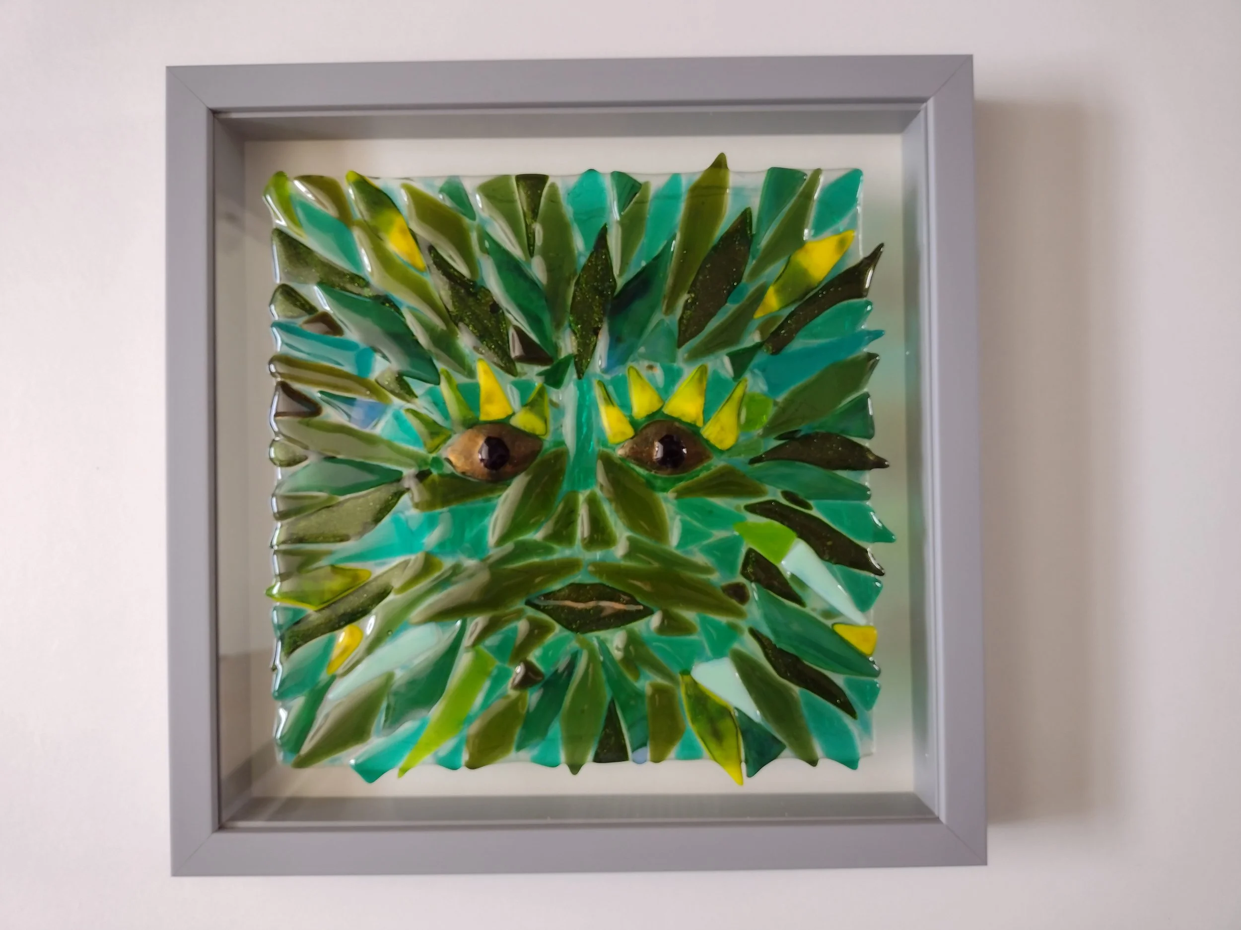 Glass green man wall art