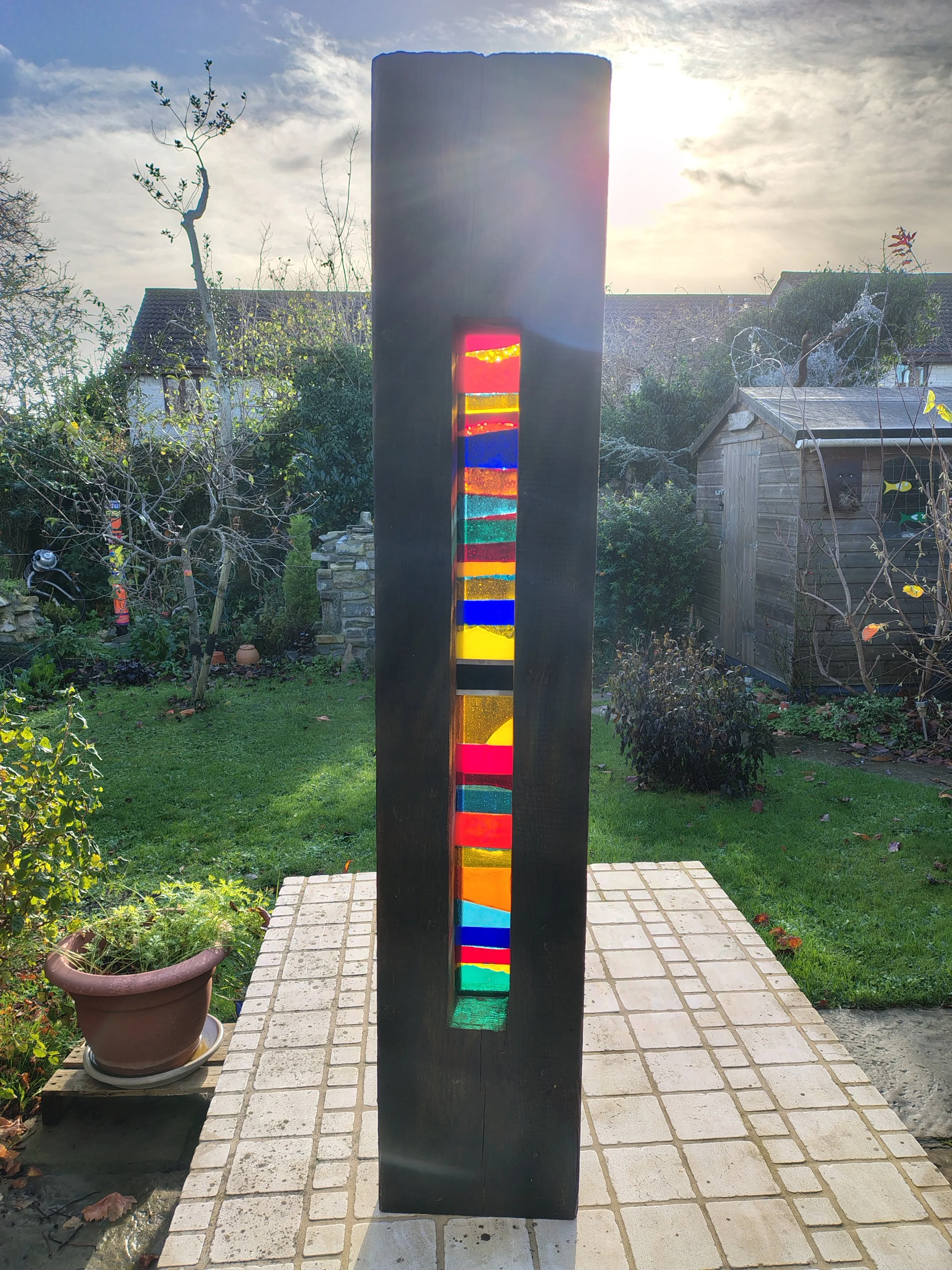 Fused glass and wood garden sculpture