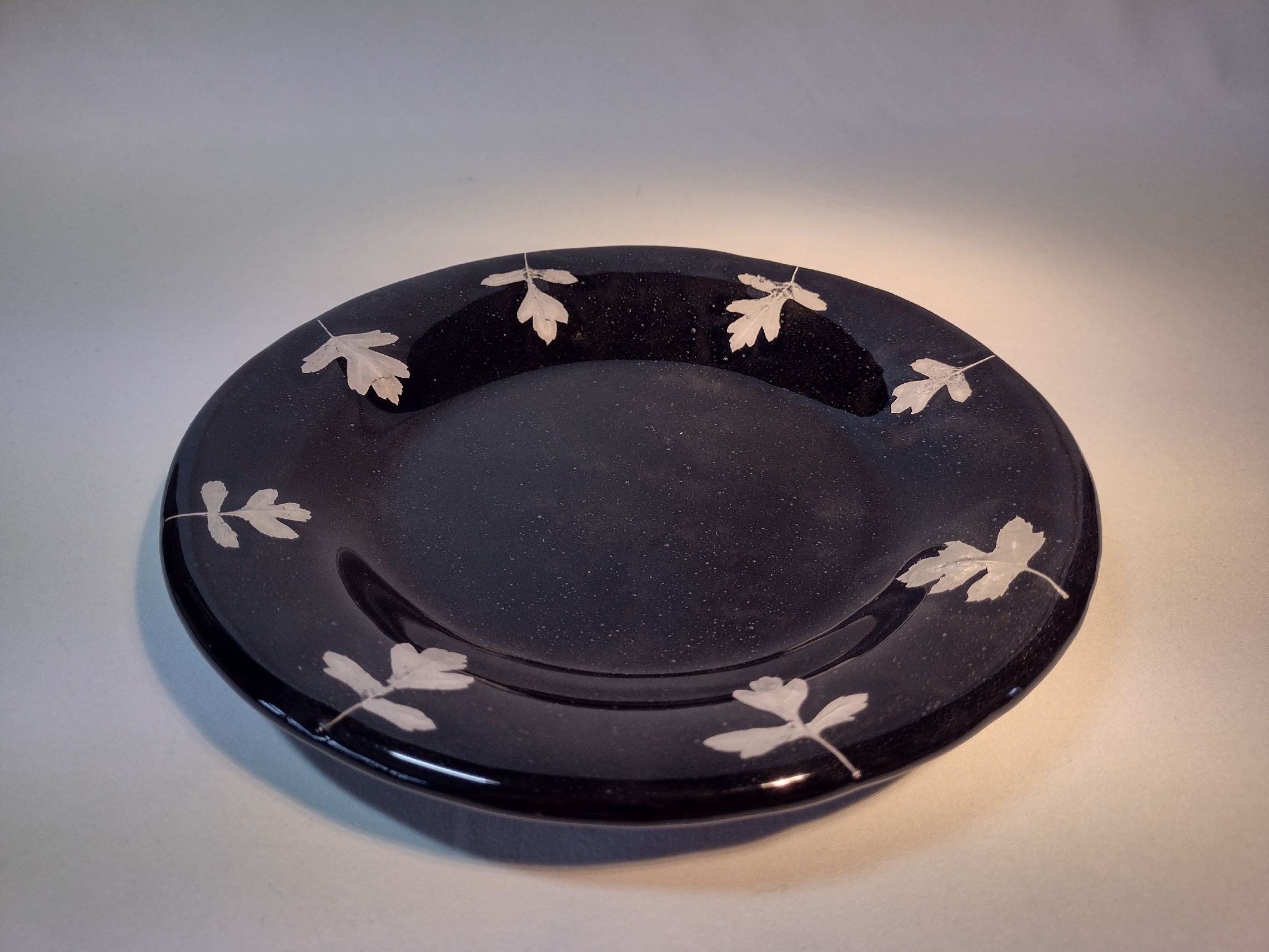 Glass plate with 'ghost' hawthorn leaves