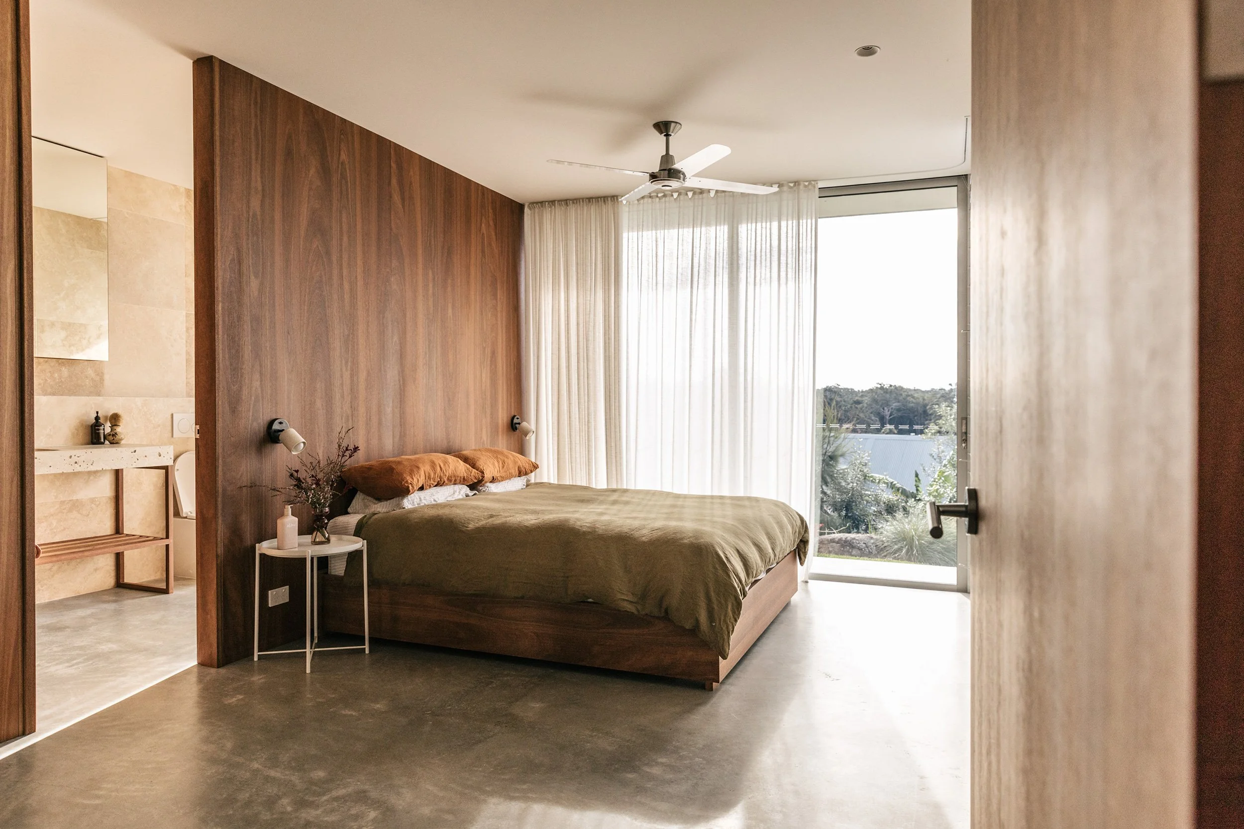 Sun filled bedroom with Australiana decor and en suite with panoramic Mollymook views