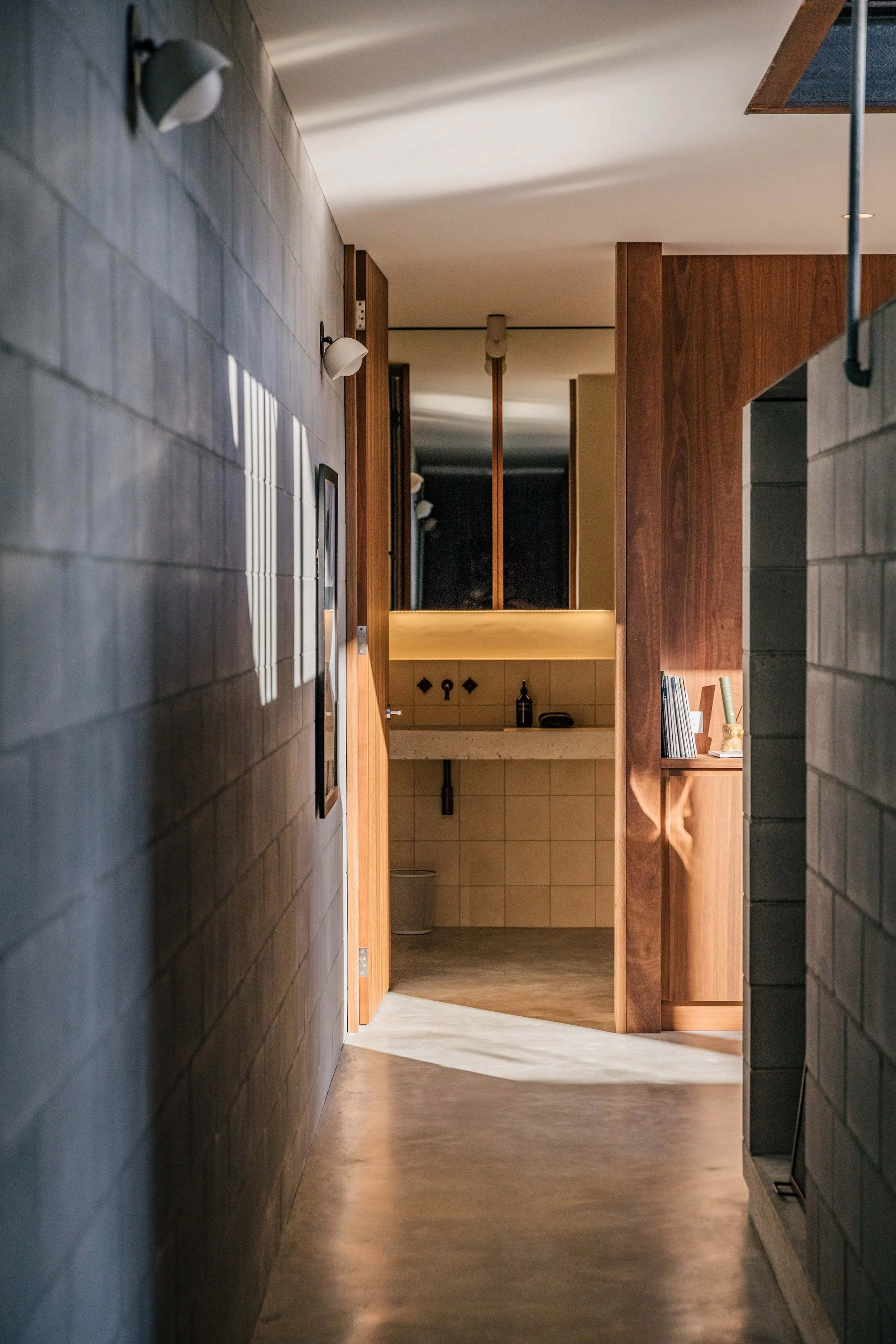 Sun soaked concrete and timber hallway